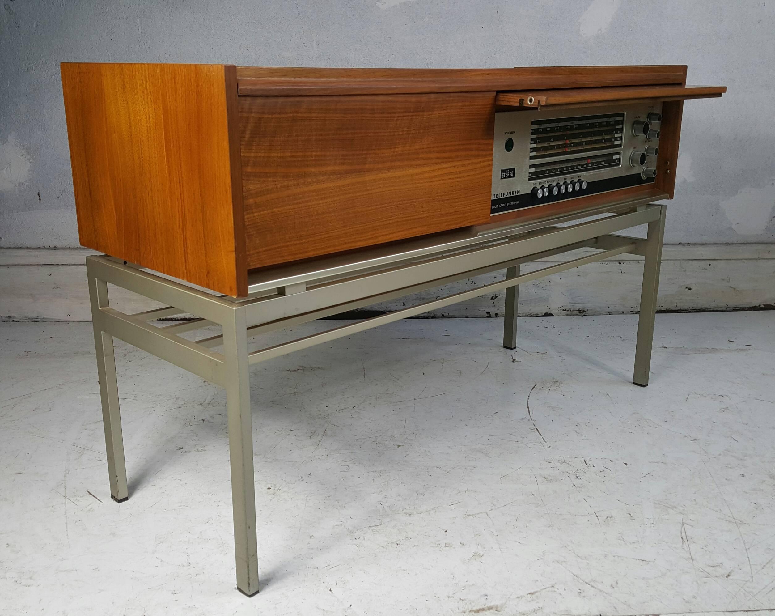 Modernist Telefunken Stereo, classic Florence Knoll design, all original, pull down panel door covers stereo if desired so it appears to look like a handsome modernist cabinet, perfect working condition, sounds amazing, looks amazing, can plug in