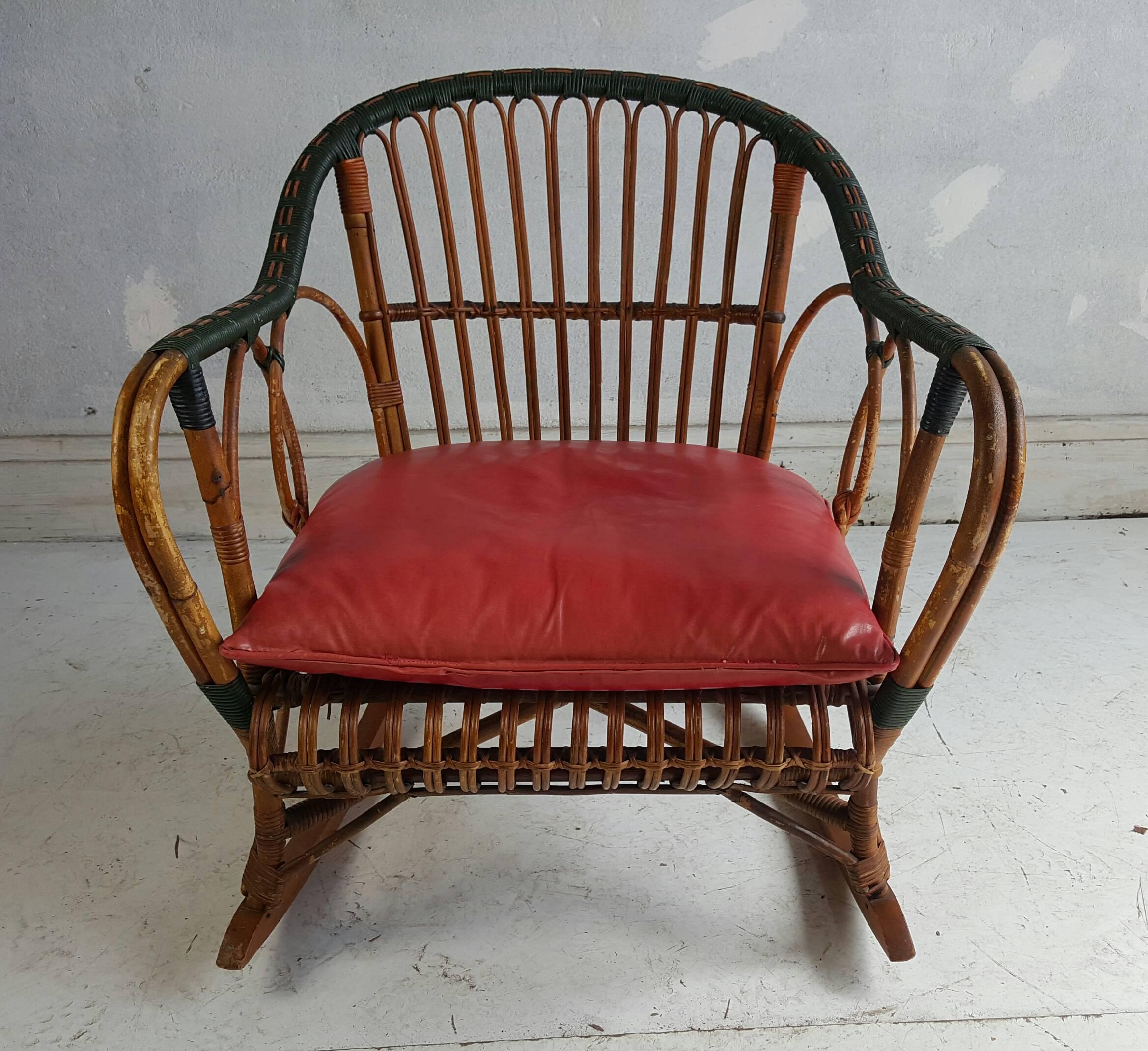 Unusual stick wicker, split reed rocking chair. Classic Art Deco style, extremely comfortable, retains original finish, wonderful hunters green patinaed paint. Attributed to Ypsilani Reed Furniture co.