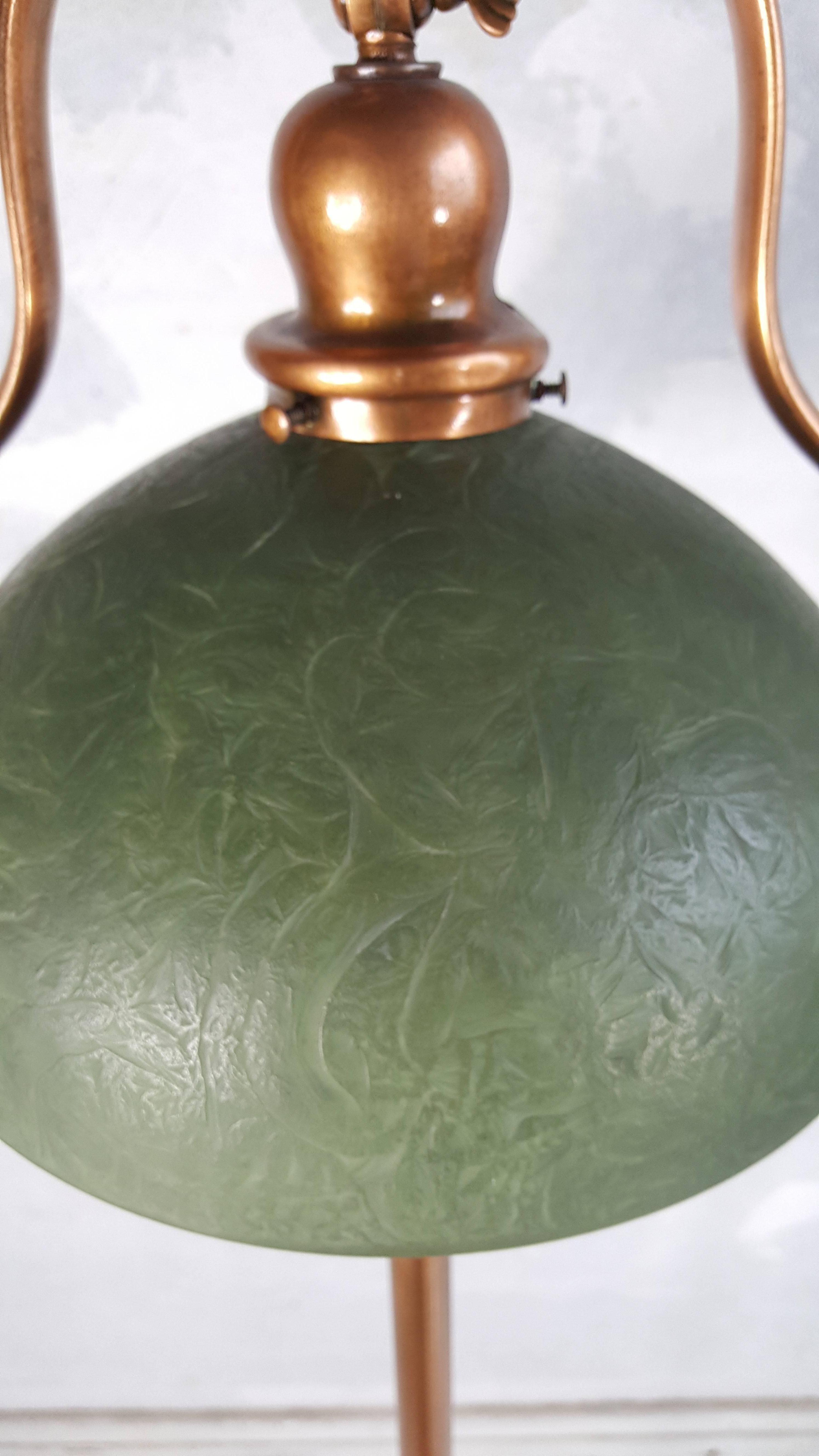 Classic form. Turn of the century copperd bronze handle floor lamp. Retains original Mosserine shade. Wonderful matte green color. Beautiful golden glow when lit.