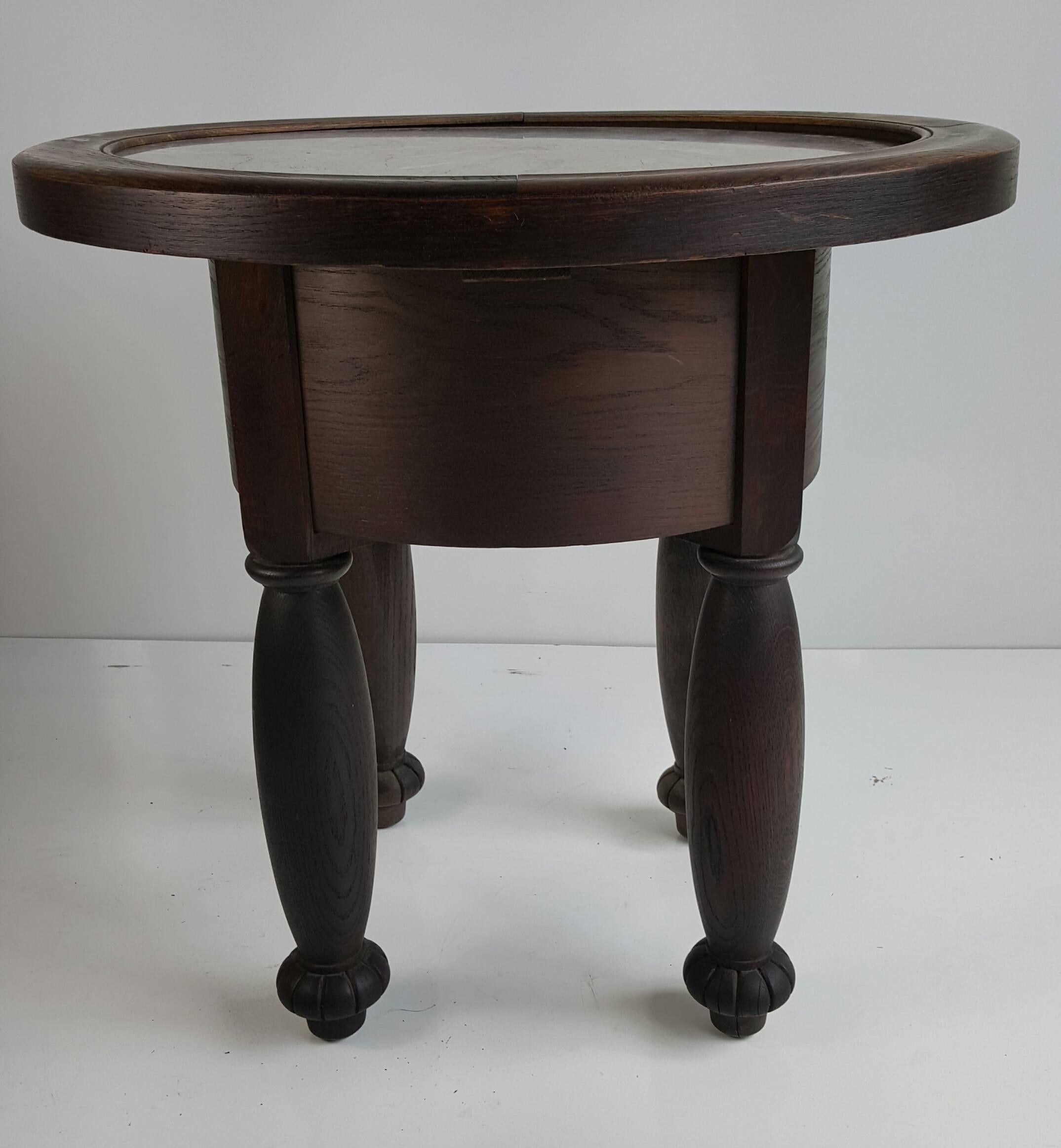 Unusual French of German Art Deco table, wonderful patina, great scale, proportion. Retains original marble-top, veined grays, pinks, blacks and browns.