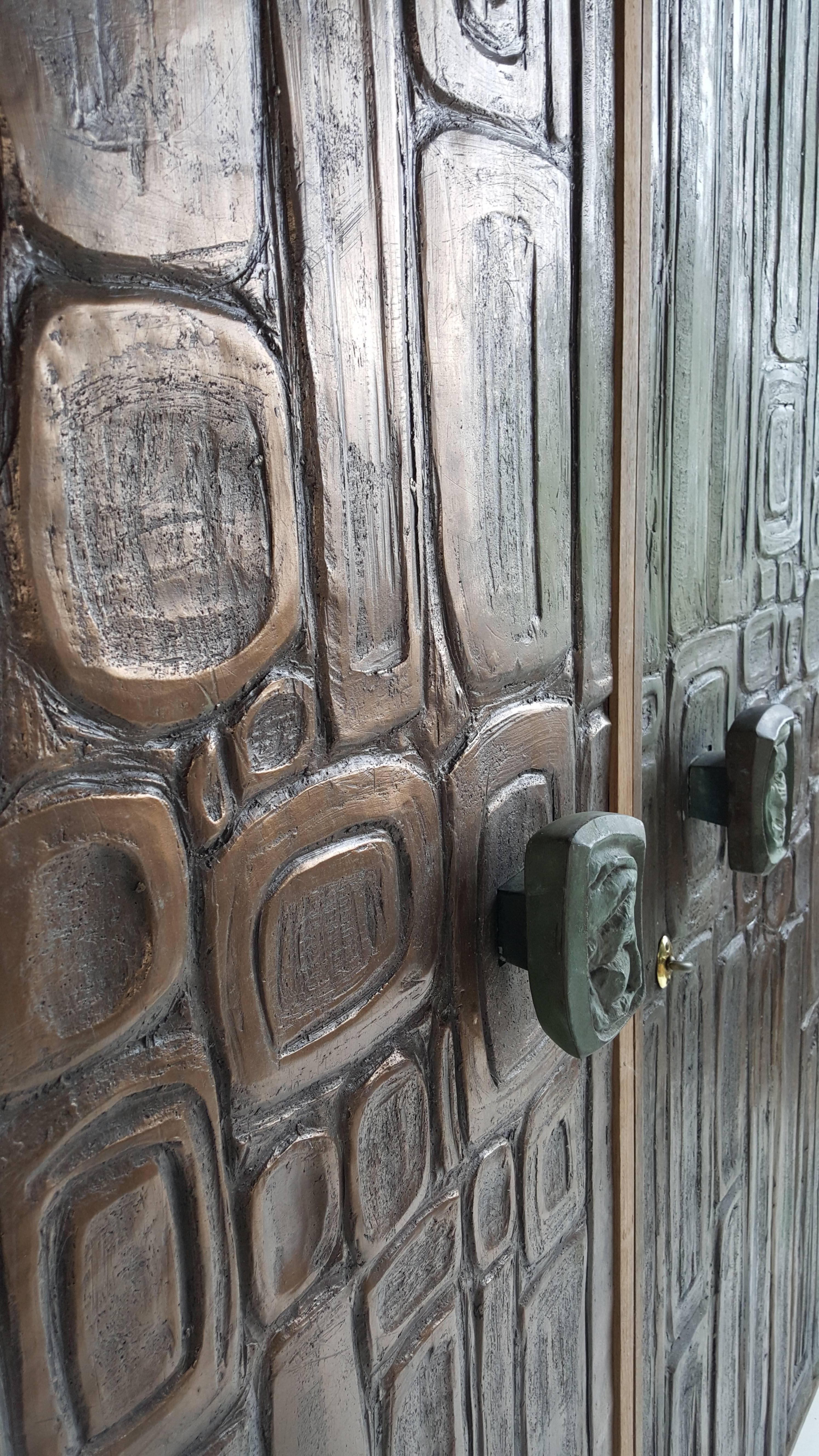 Unique sculptural doors in the style of McCarrol and Gillespie known for the 