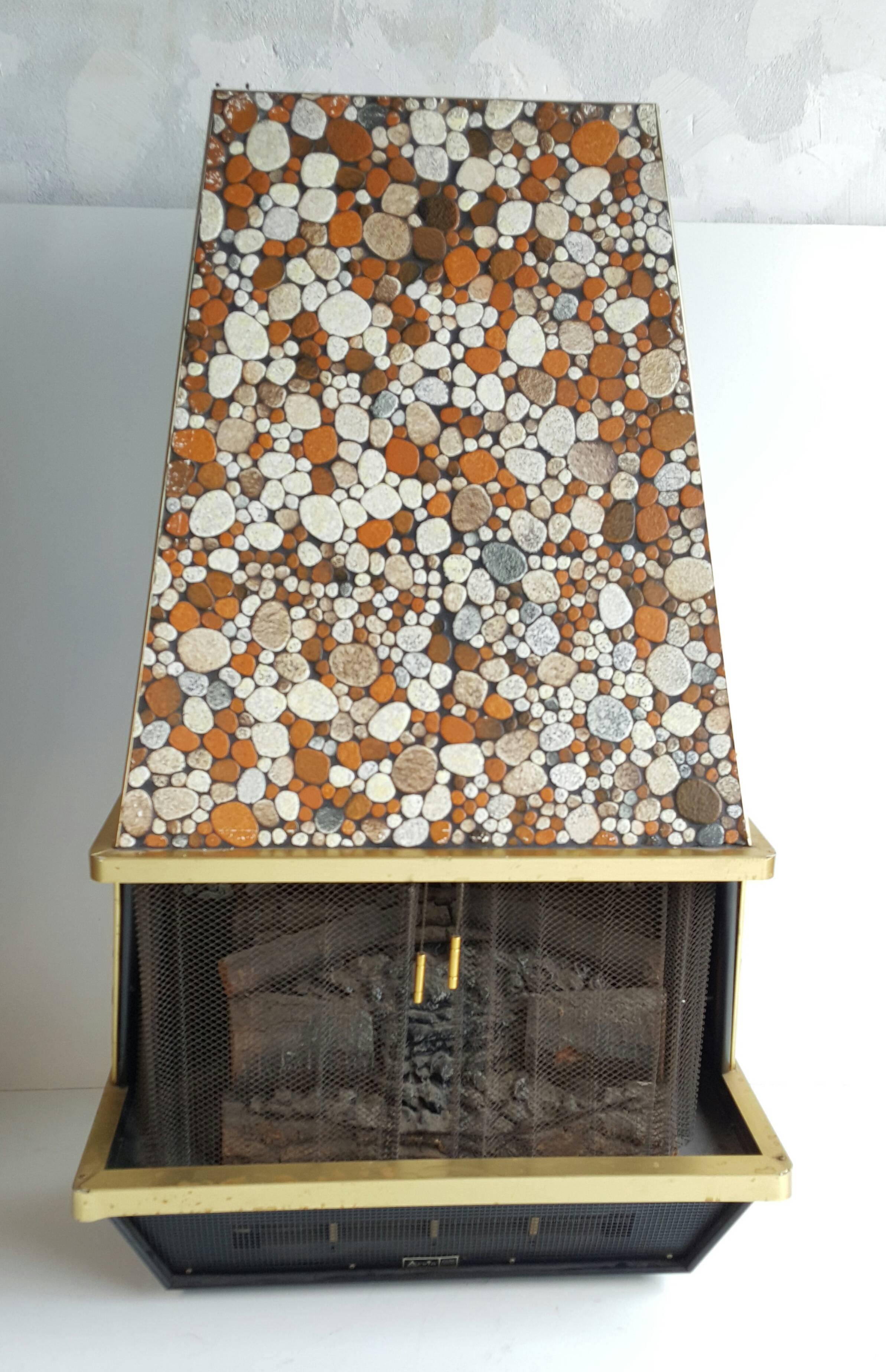 1970s wall hung electric fireplace manufactured by Arvin, unusual stone veneer surface, tested and working, throws some heat.