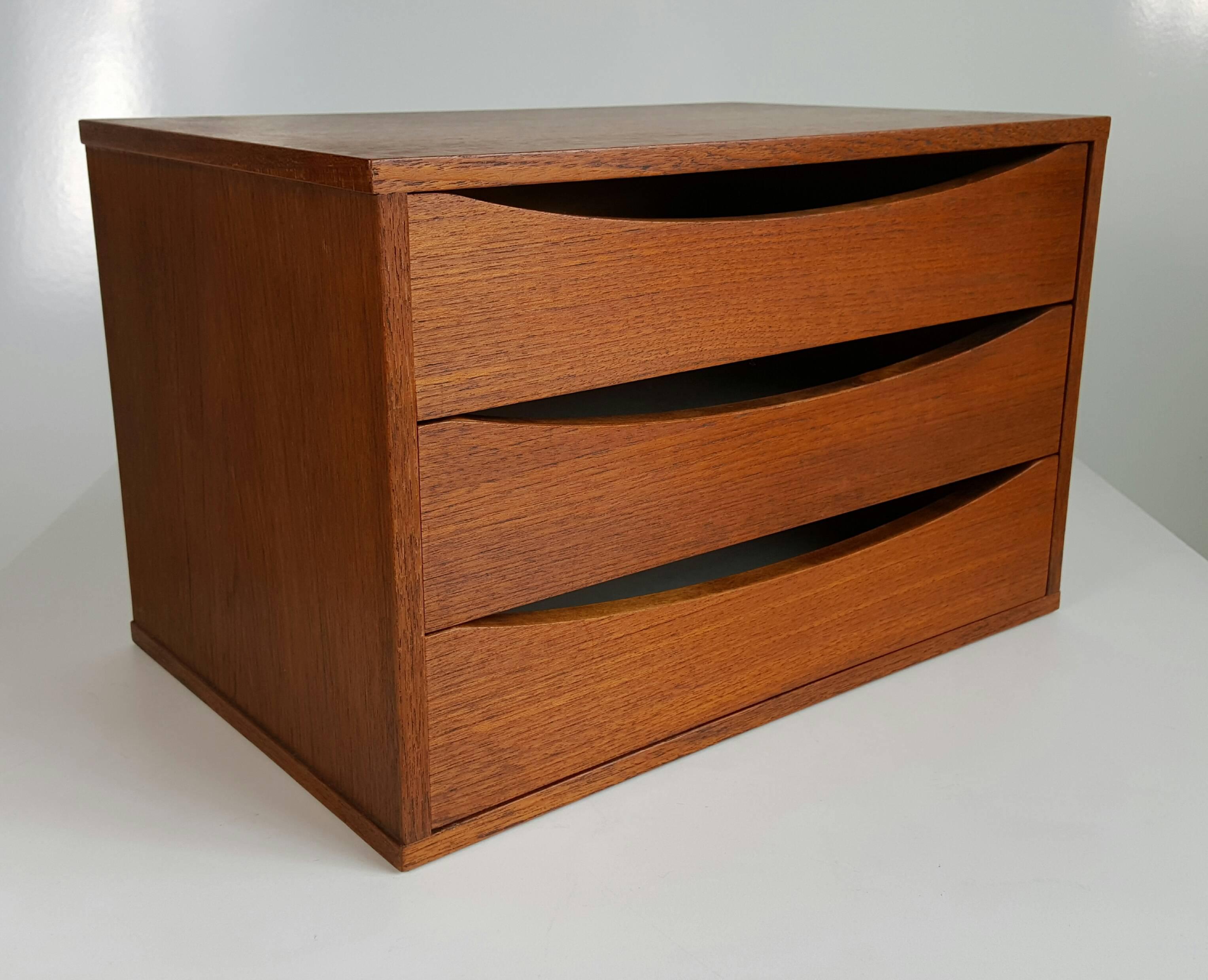 Wonderful aged teak three-drawer organizers, beautifully crafted, finished on all sides, can be used as jewelry or flatware chests.

Arne Vodder (designer):

Along with Vernor Panton, Arne Vodder was a leading light of what might be called the