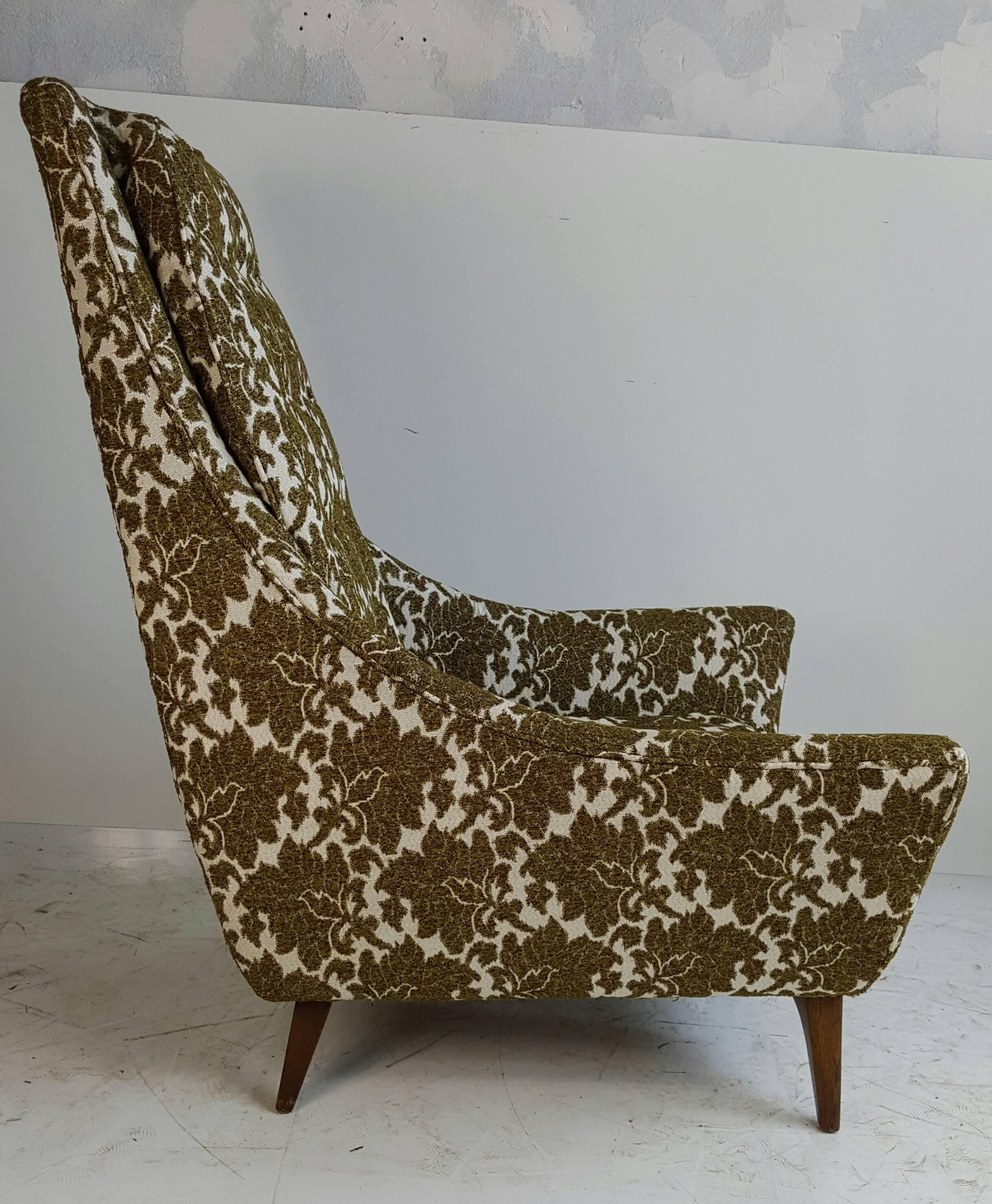 Classic Modernist high back lounge chair. Recently reupholstered in a wool cotton large print floral fabric, nice sculptural walnut base, see other listing for matching sofa.