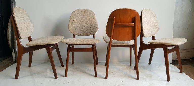Classic Danish Modern Ding Chairs designed by Arne Hovmand Olsen,, Made in Denmark,, Retains original wool upholstery,brass grommet floating detail,,, Sold teak wood construction,, Wonderful original condition,Sturdy,,no wobble,,tight joints,,,Warm