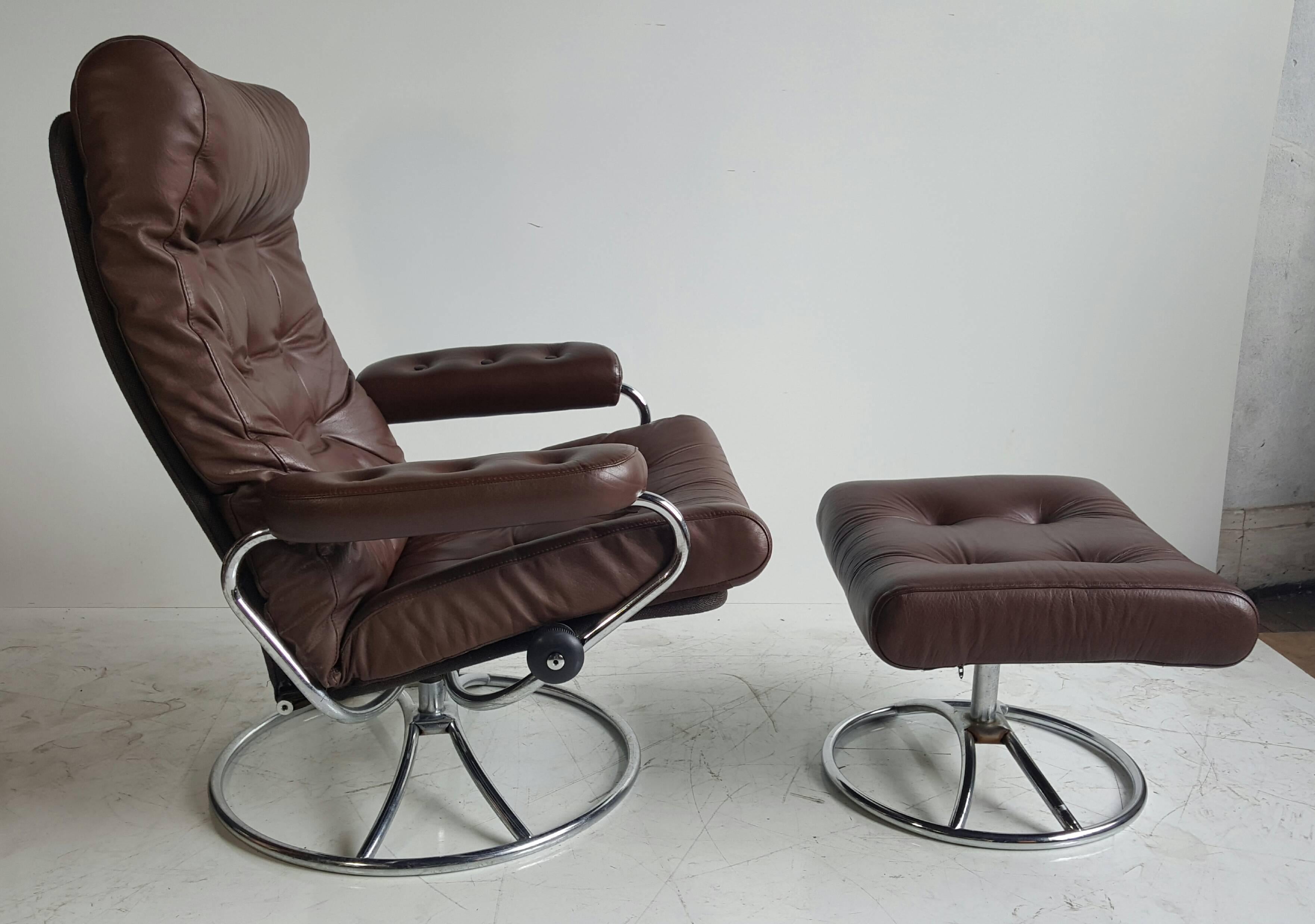 Vintage Ekornes Stressless recliner and ottoman made in Norway. Features button-tufted leather with roll-neck support and brown tweed fabric back around a chrome frame. Fully reclining and adjustable. Turning locking knobs on both sides for