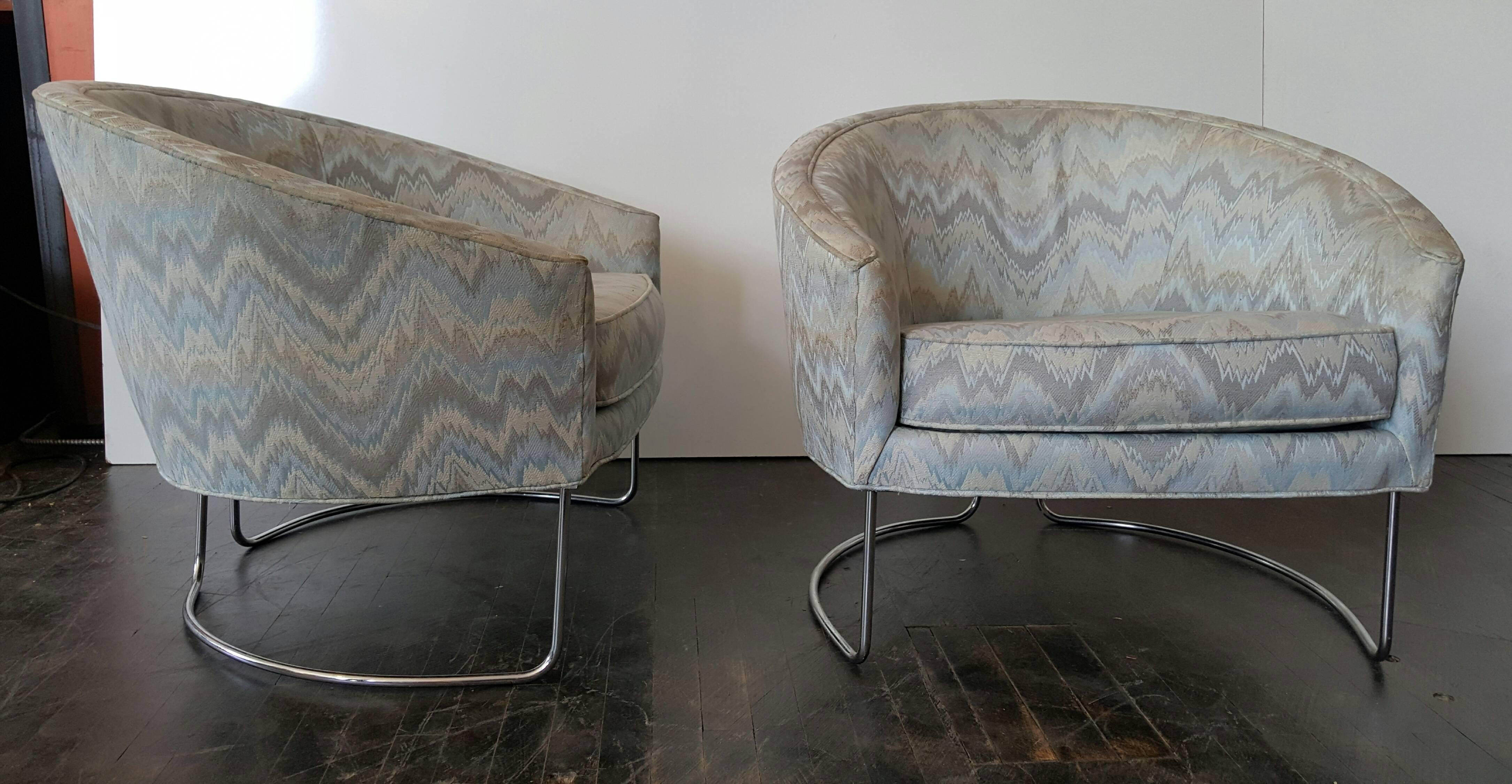 Classic pair tub chairs, chrome and fabric by Milo Baughman. Chairs retain original flame stitch fabric, can use as is would be fabulous reupholstered. Extremely comfortable.
