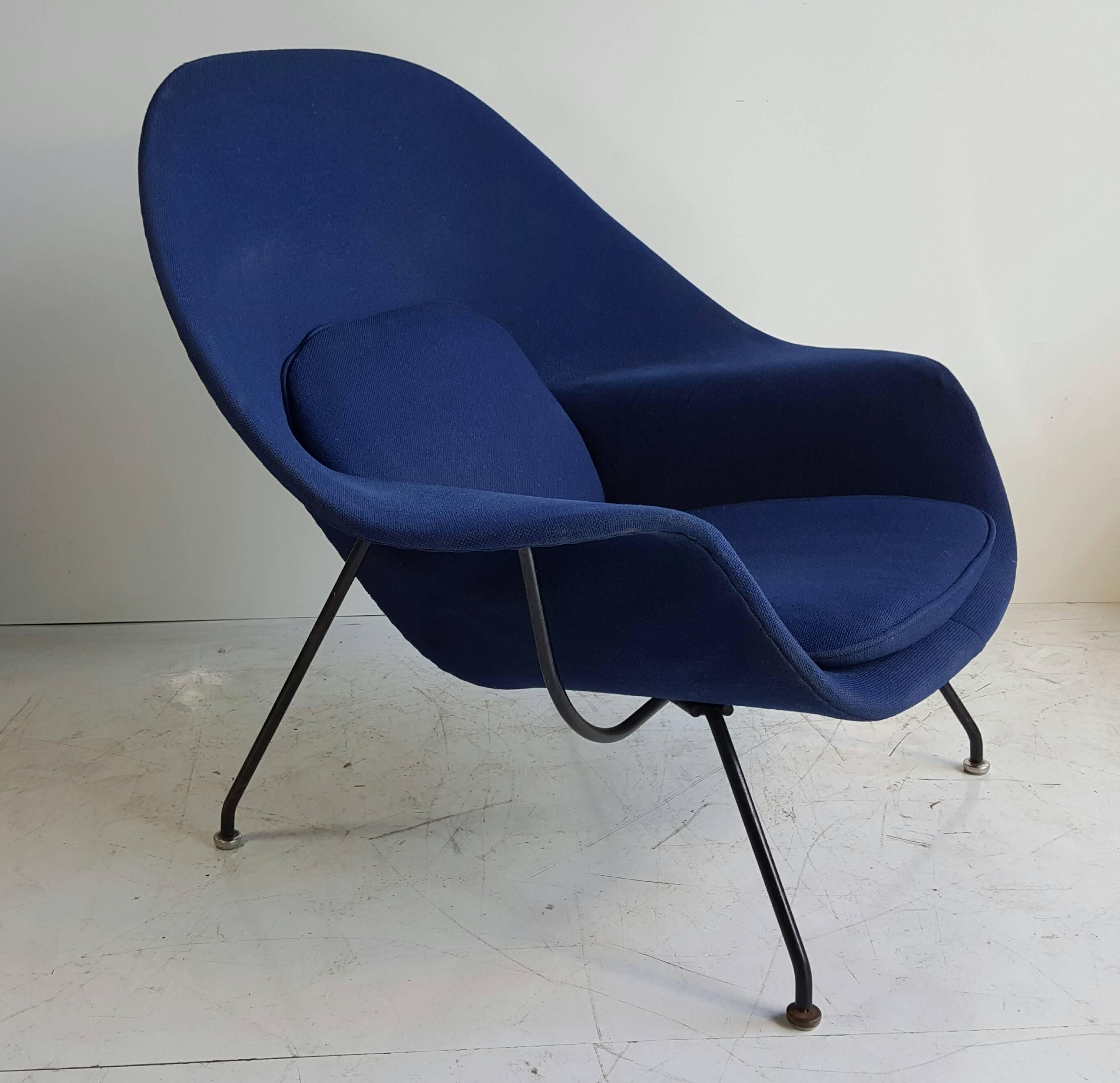 Classic modernist, Eero Saarinen's 'WOMB' chair manufactured by Knoll. Nice early version, heavy black iron base. Retains original royal blue Knoll fabric, overall nice original condition.