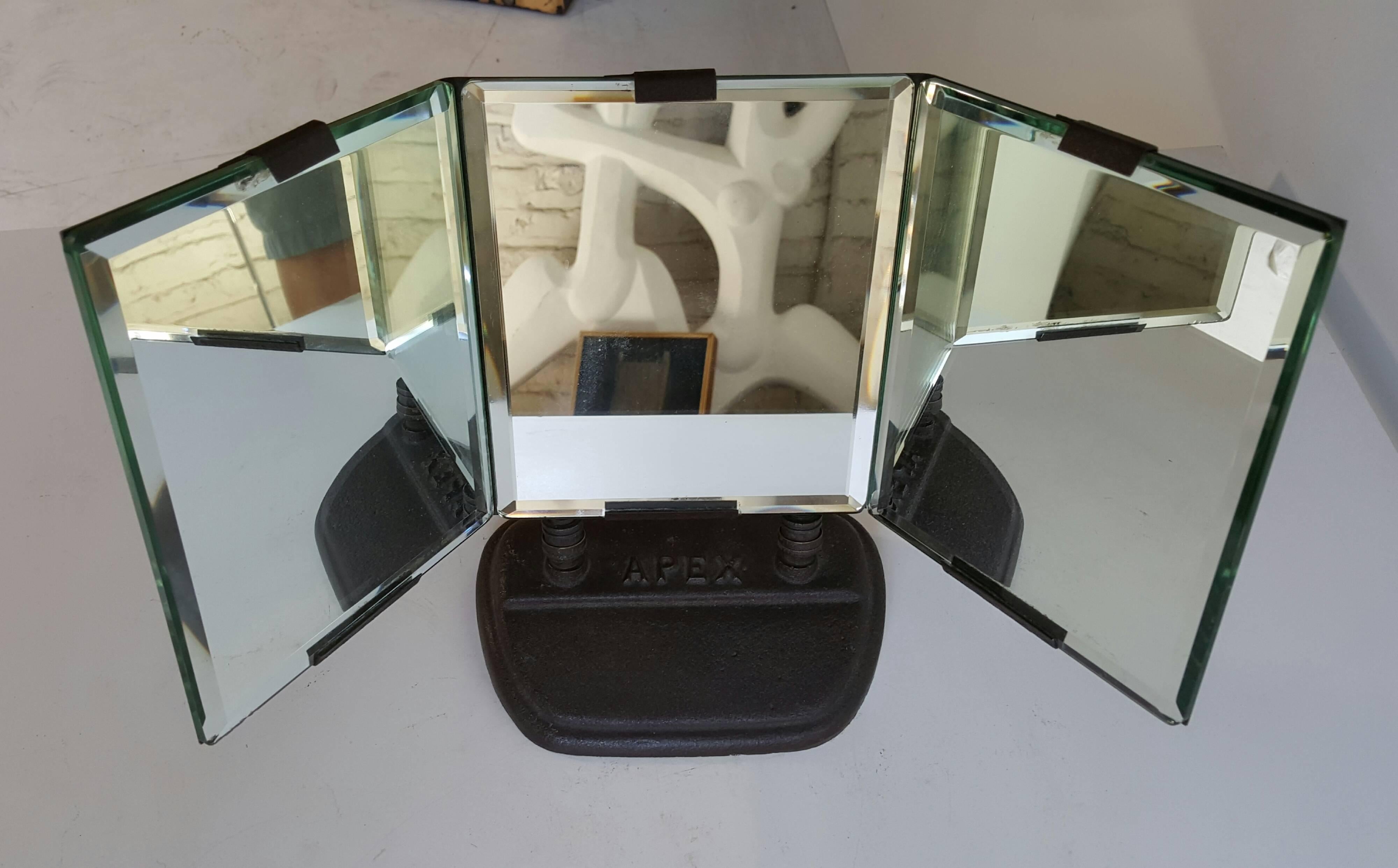 Art Deco triple mirror adjustable forward and backward motion featuring three bevel mirrors, wonderful scale and proportion, metal, Industrial yet sleek, elegant design, mint original condition and manufactured by Apex.