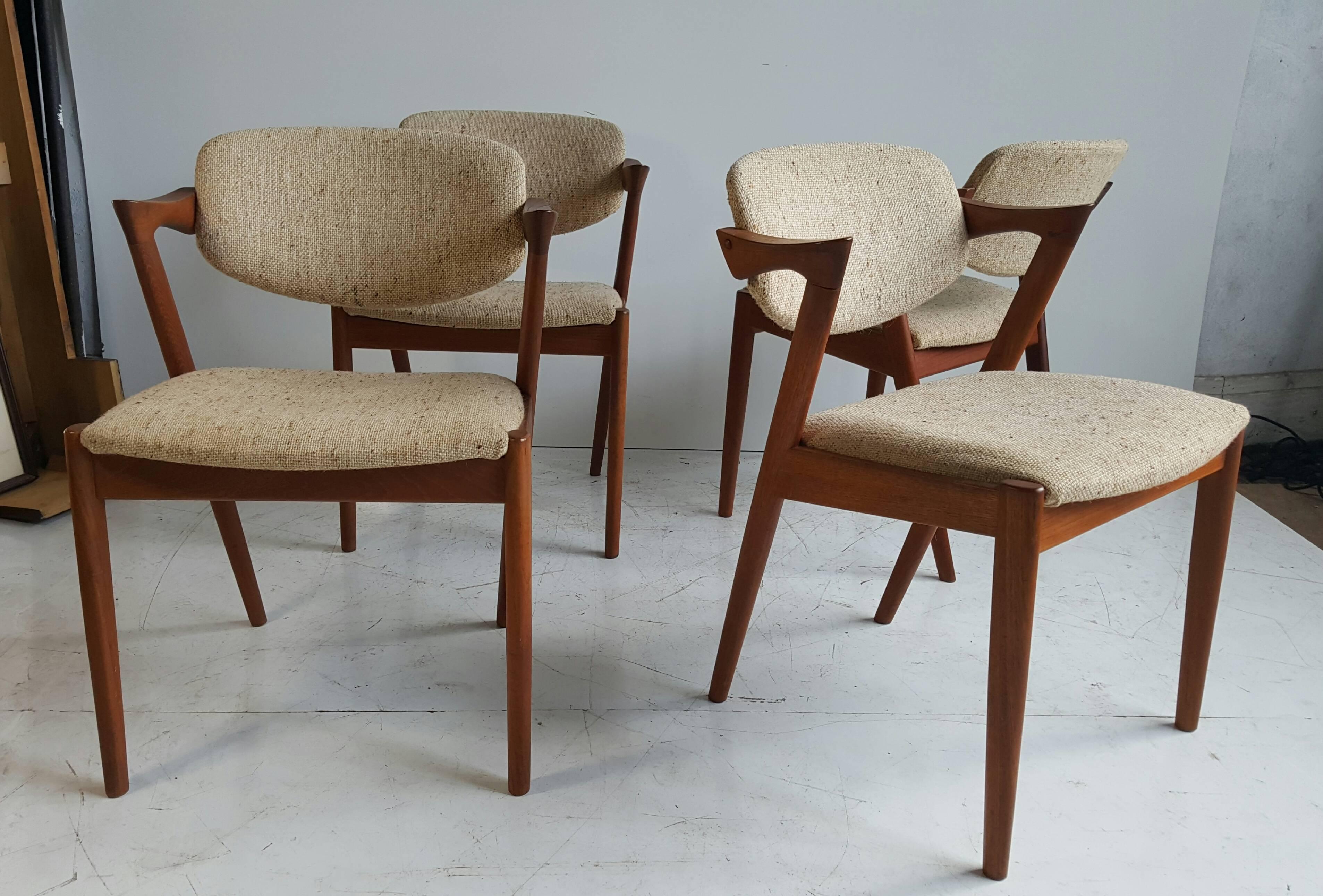 Iconic Danish modern armchairs in original upholstery. Designed in 1956-1957 by Kai Kristiansen. Manufactured at Schou Andersen's factory. Wonderful teakwood frames sturdy, no wobble and superior quality. Chairs retain original wool fabric seats and