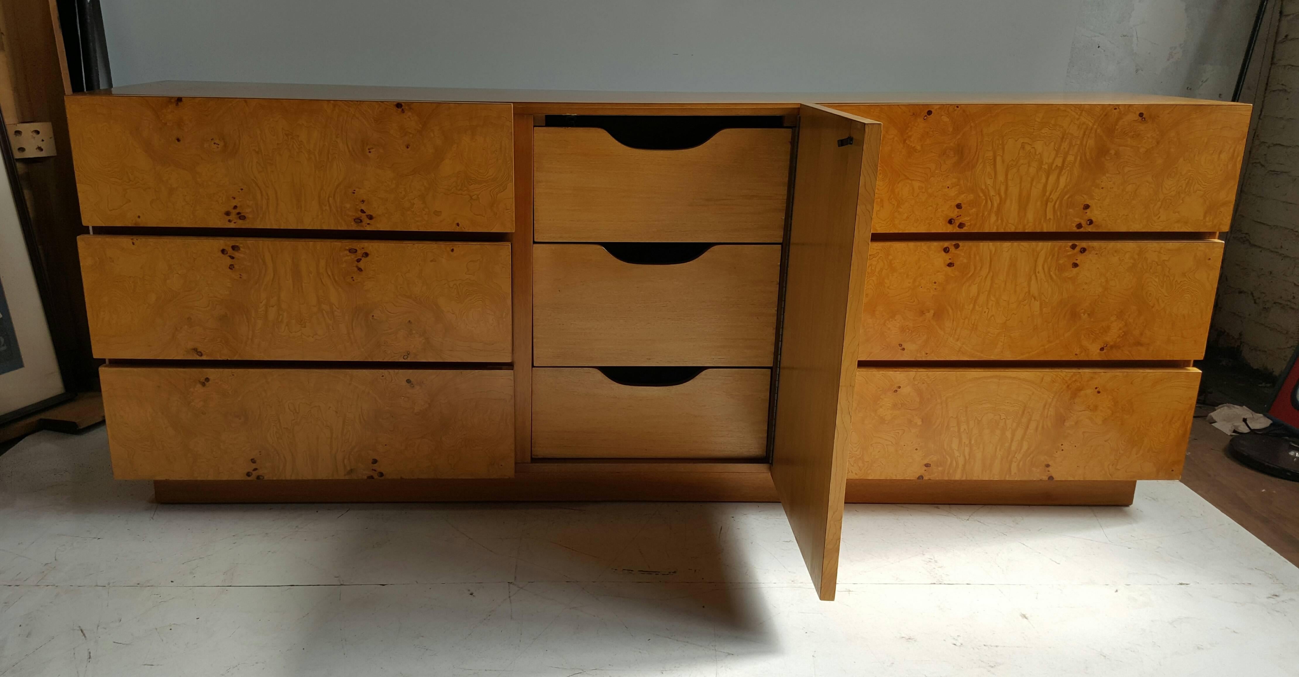 Classic Mid-Century Modern dresser or cabinet designed by Milo Baughman for Lane Furniture Co. Beautifully figured olive burlwood door and drawer fronts. Three generous drawers, right and left, cabinet door atop of three additional drawers. Would