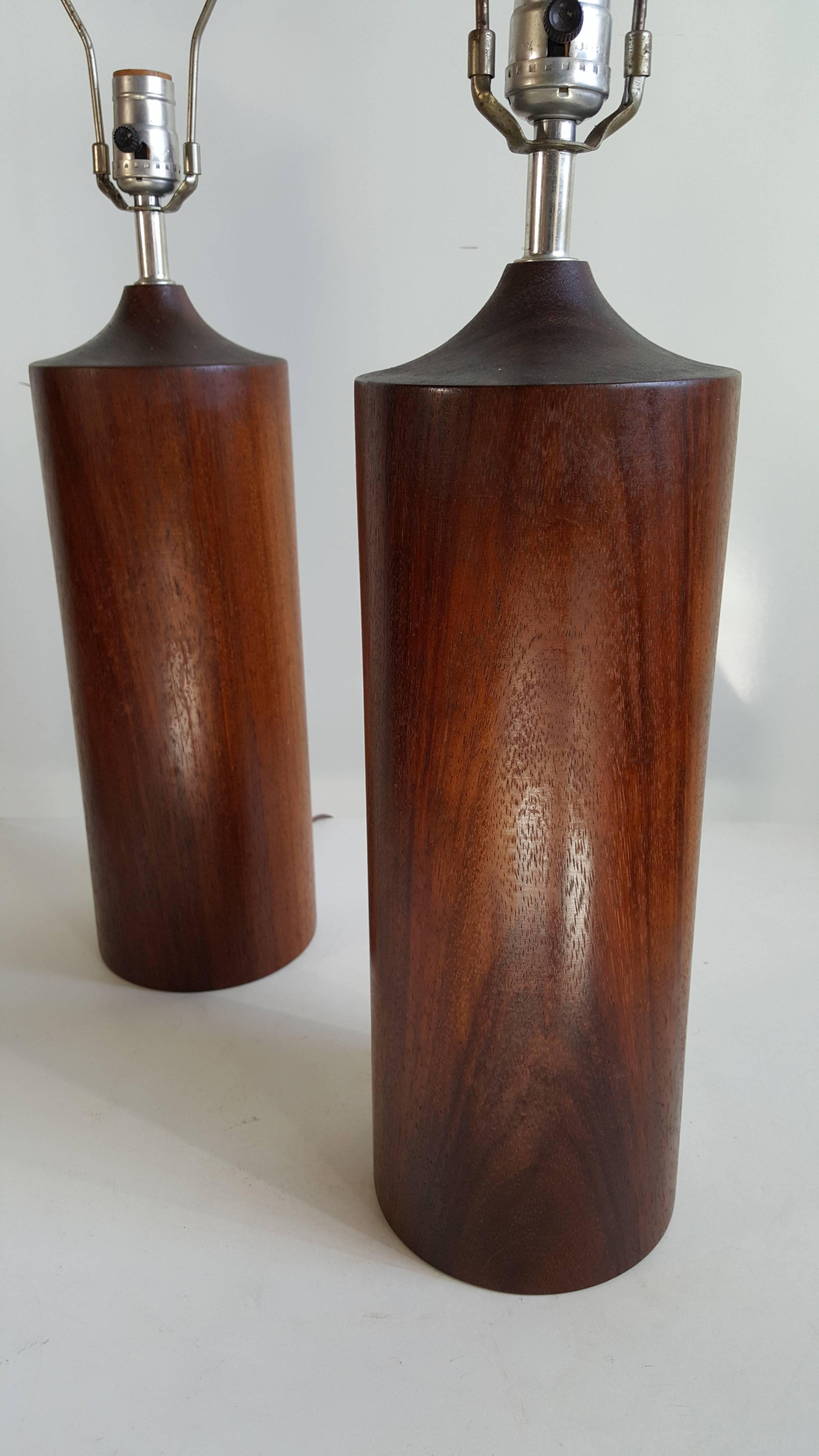 Classic pair of modernist turned walnut lamps manner of Phillip Lloyd Powell, wonderful design and proportion. Solid wood, nice original finish.