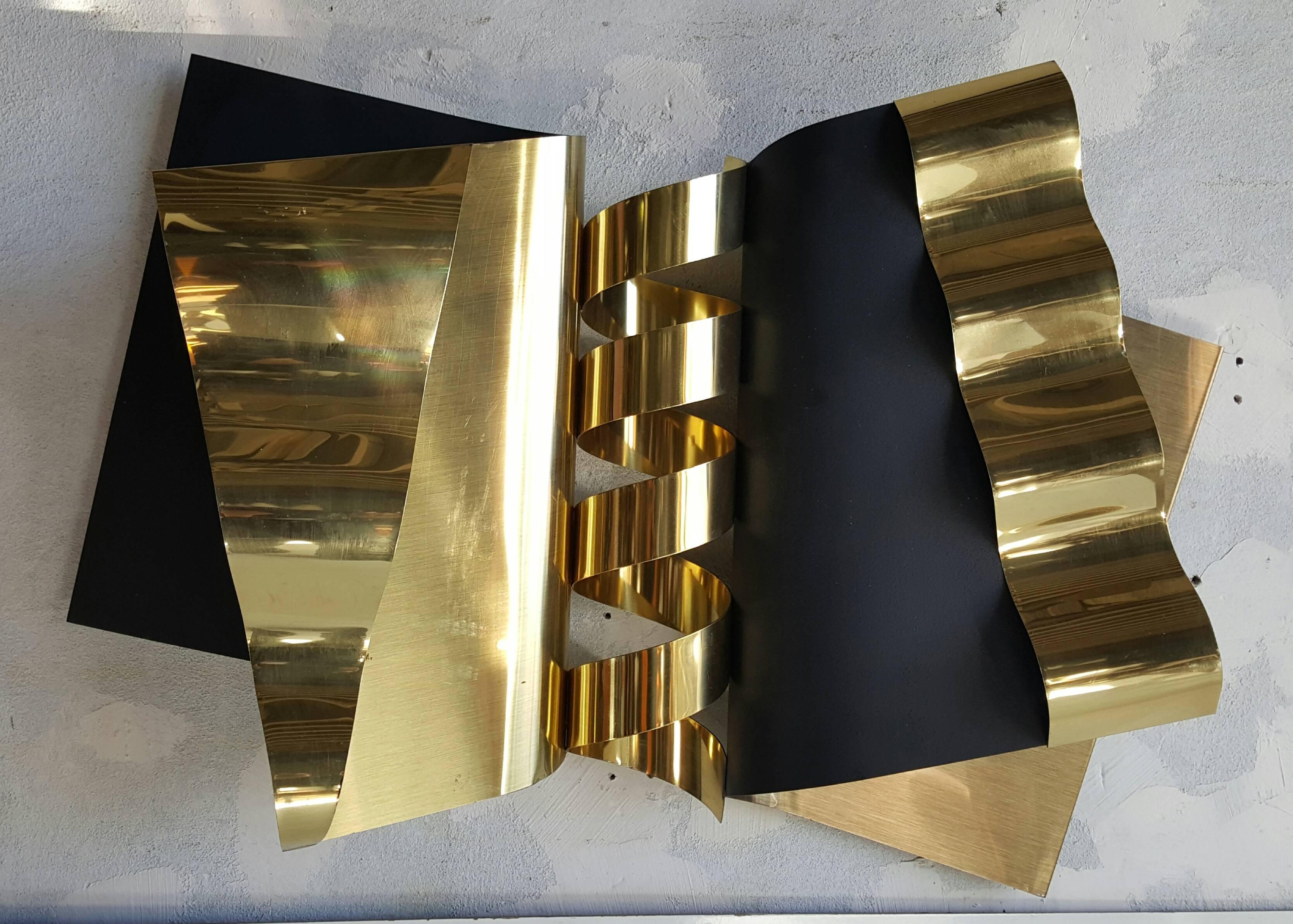 Classic modernist contemporary wall art sculpture. Brass and black enamel construction. Retains original C Jere hang tag. Stunning.
