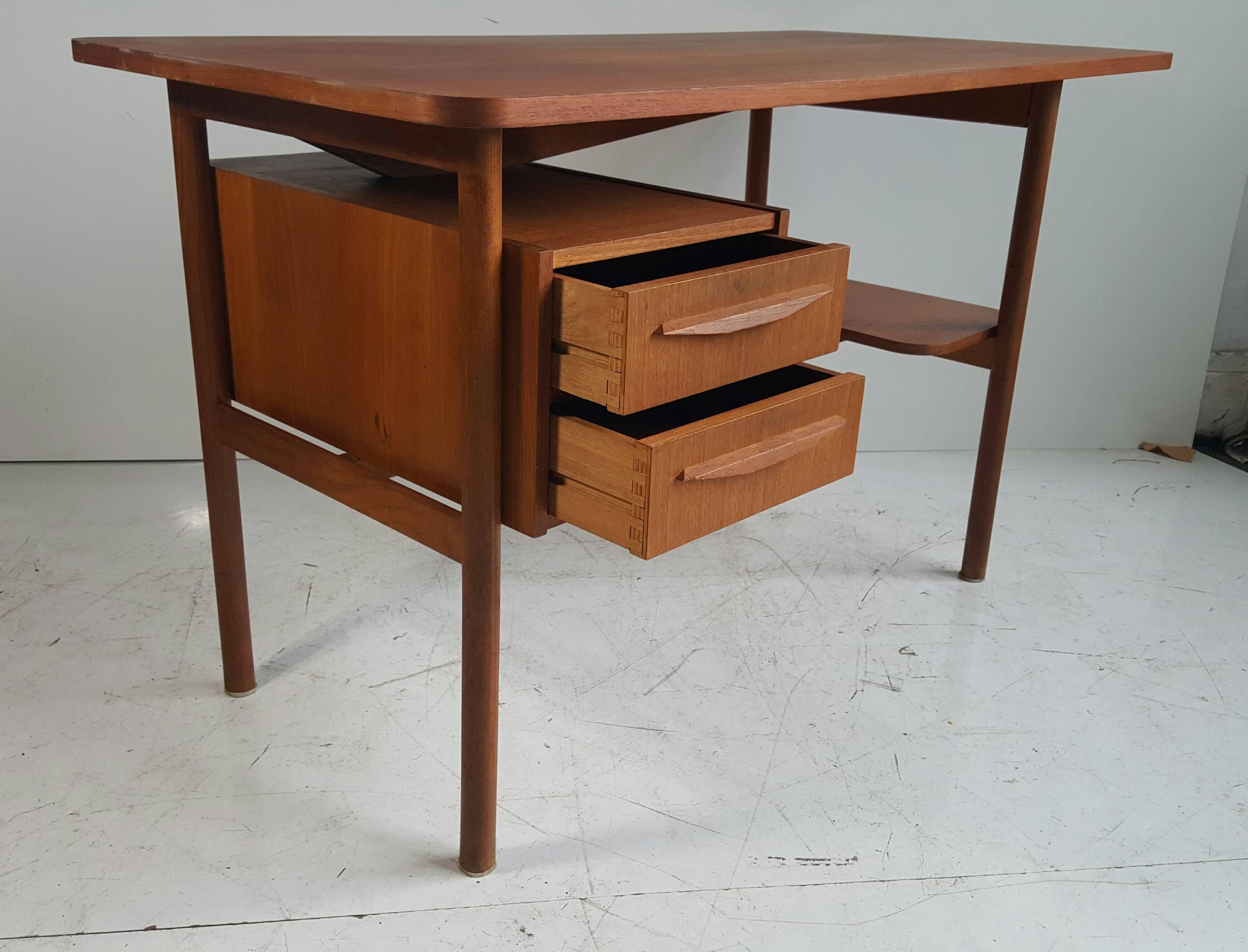 Gunnar Nielsen Tibergaard designed this desk in the 1960s. He joined Ikast Møbelfabrik in 1946. These small desk are highly loved and quite rare to find, a really nice small desk, that can fit in any space. Good original condition.