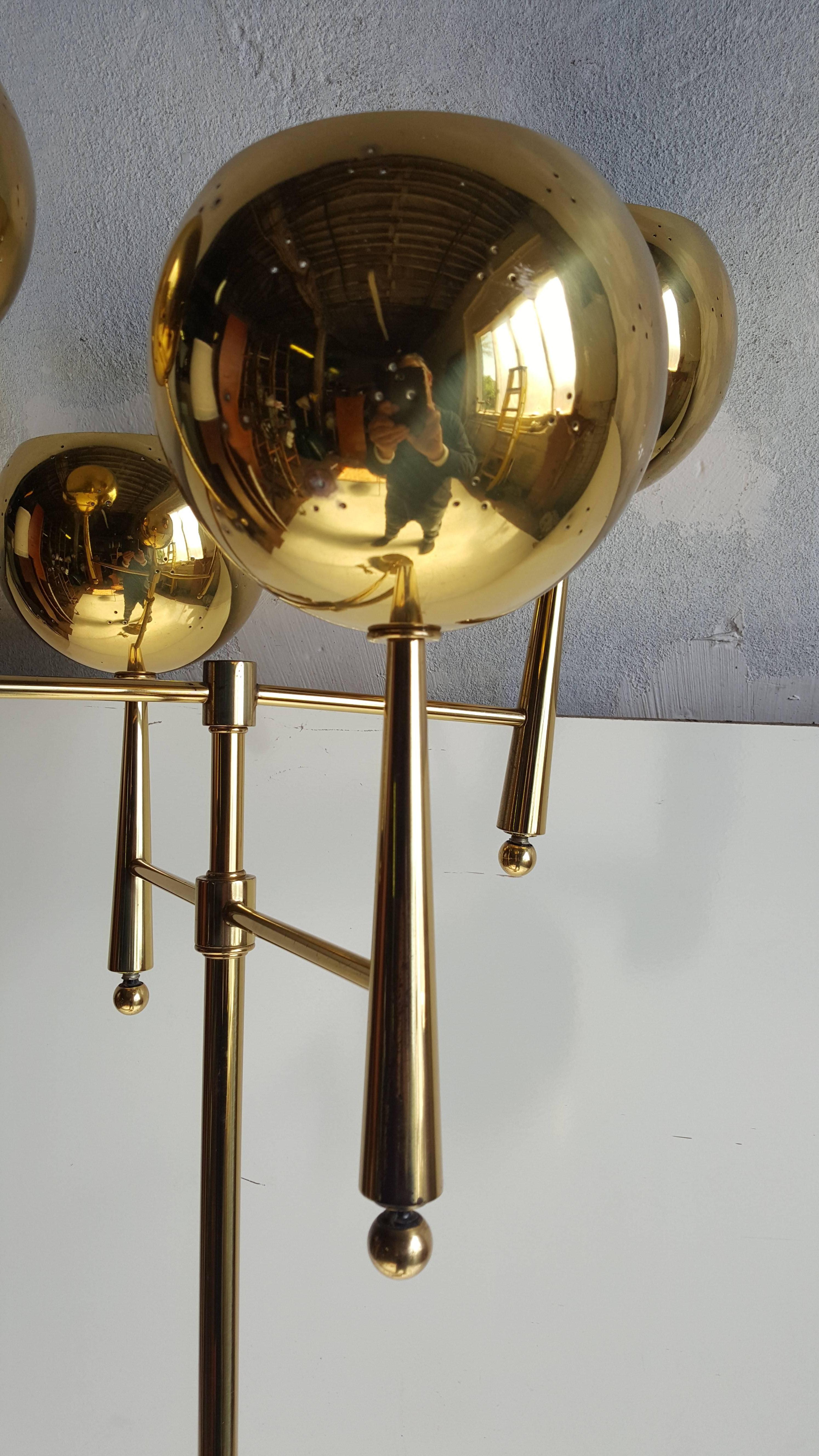 Classic modernist , Regency brass floor lamp manufactured by Stiffel, highest of quality, featuring brass base, stylized standard and stunning four eyeball brass cup shades, sleek elegance that would fit seamlessly into any modernist, antique,