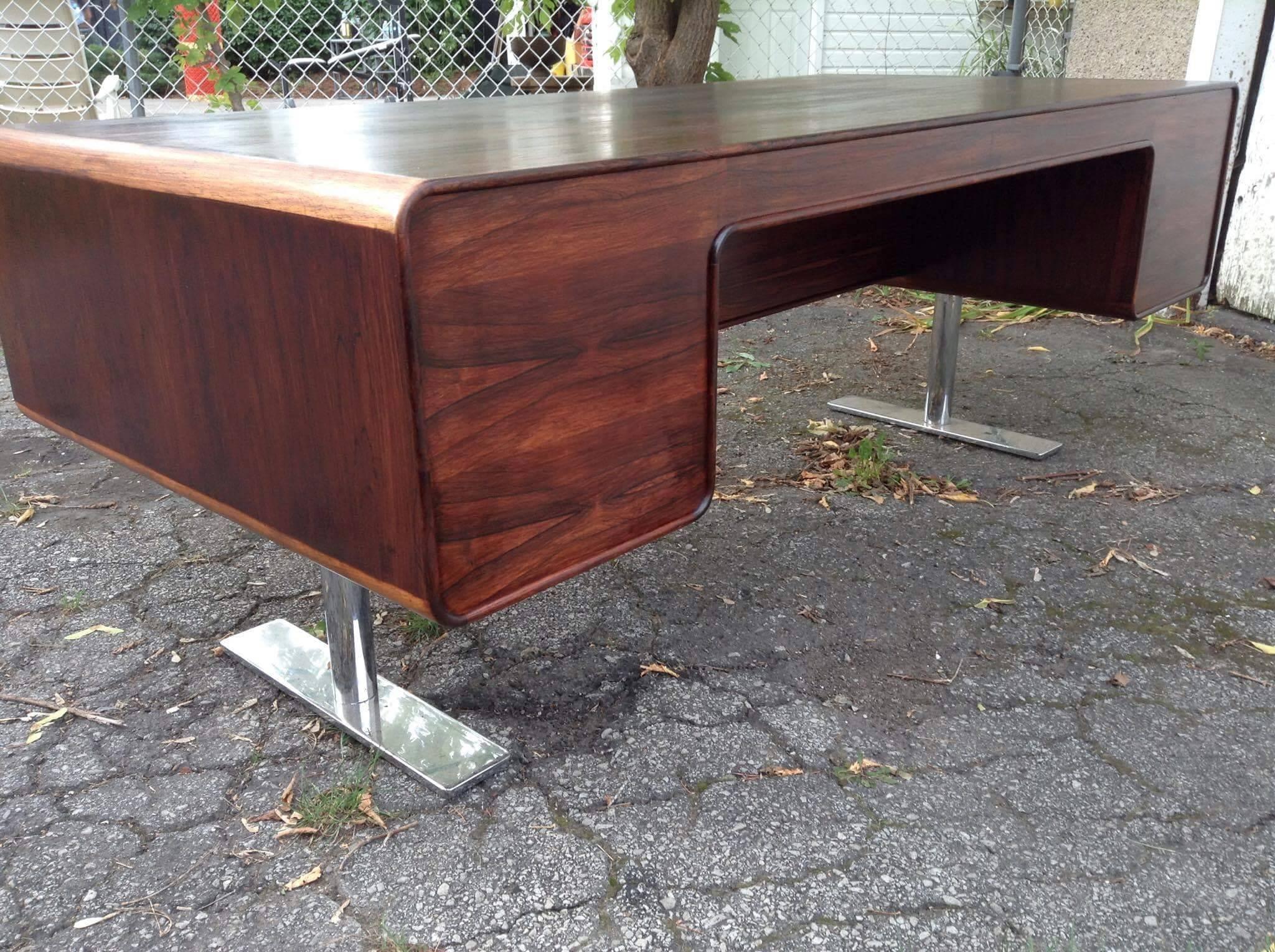 Important, seldom seen Leif Jacobsen, rosewood executive desk made in Denmark; Amazing design, extremely functional, featuring large file drawer, five generous drawers, long pencil drawer, wonderful bookmatched rosewood.