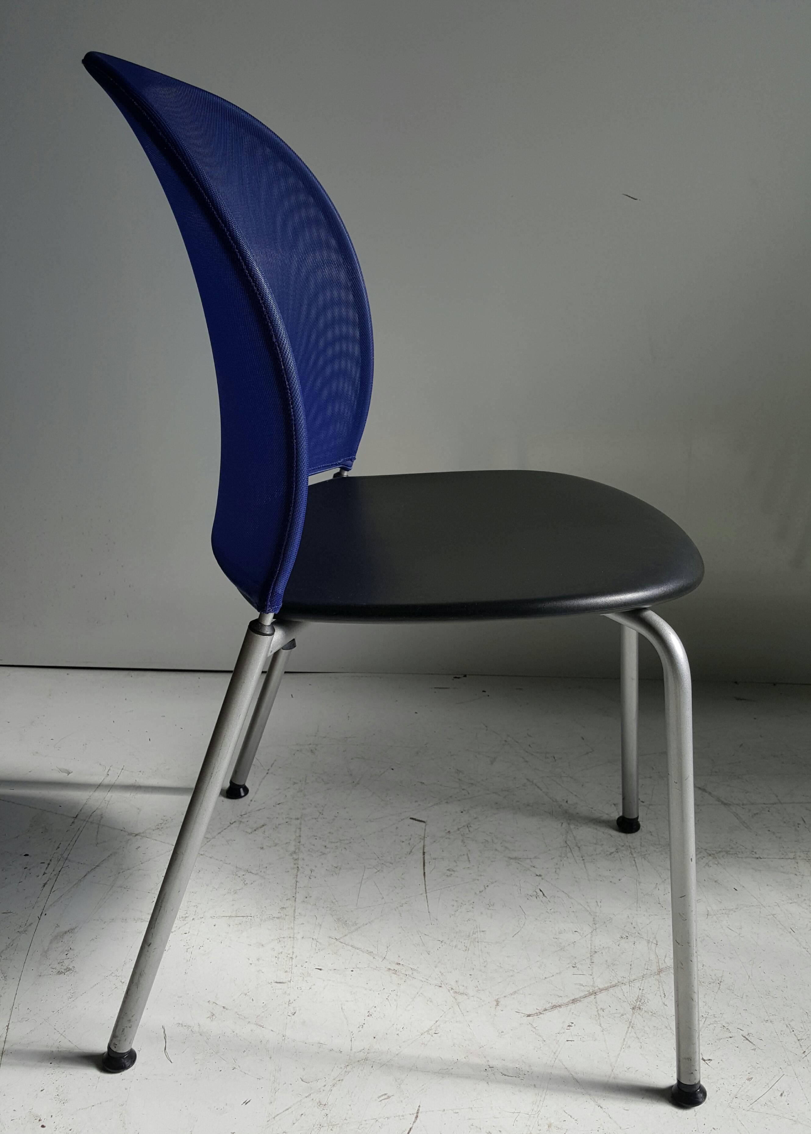Dietiker chairs.

Orta chair.
The special thing about Orta is the optimally shaped, elastic back with the textile cover. Features royal blue netting, polymide seat, extremely comfortable, very stylish, stackable option... designed by Christoph