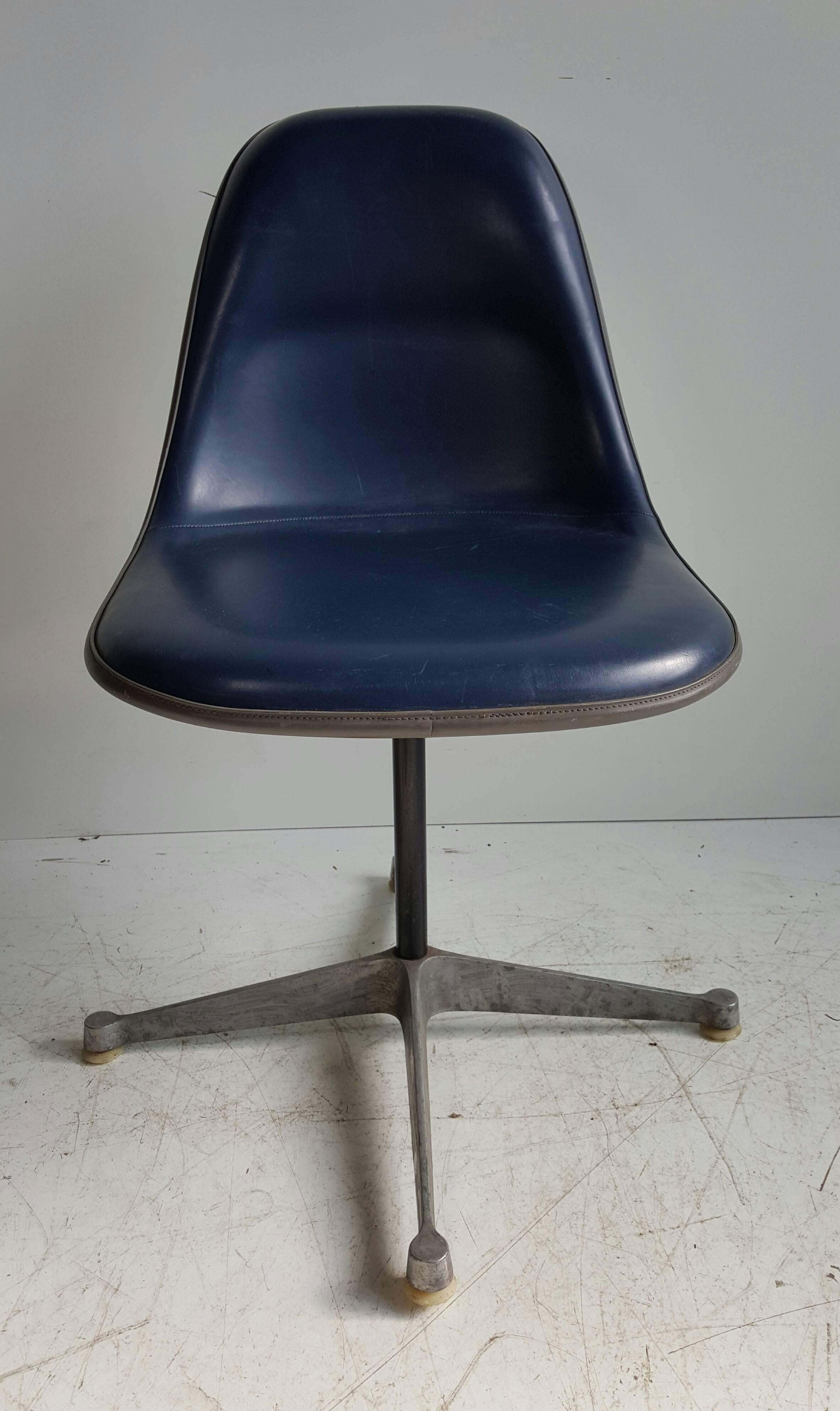 Rare PSCC desk chair designed by Charles & Ray Eames for Herman Miller Secretary chair with original Royal Blue Naugahyde. Chair fully swivels and features double pad (upper) for ultimate comfort, this chair was produced for a short time. Retains
