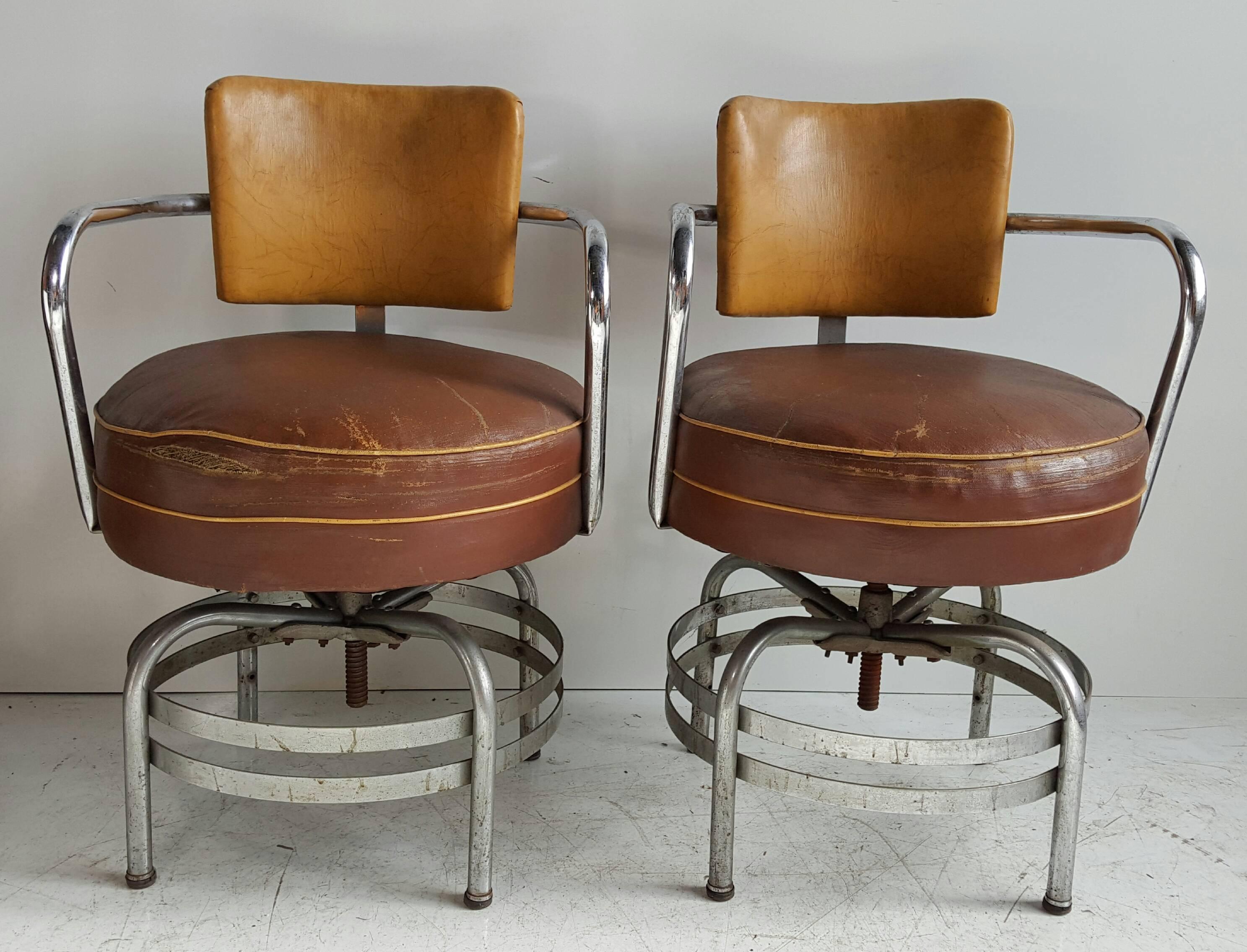 Classic 1930s American Art Deco / Machine Age tubular chrome swivel armchairs, amazing form, patina, all original, retain original oil cloth round seats, fit seamlessly into deco, modern, contemporary, eclectic environment.