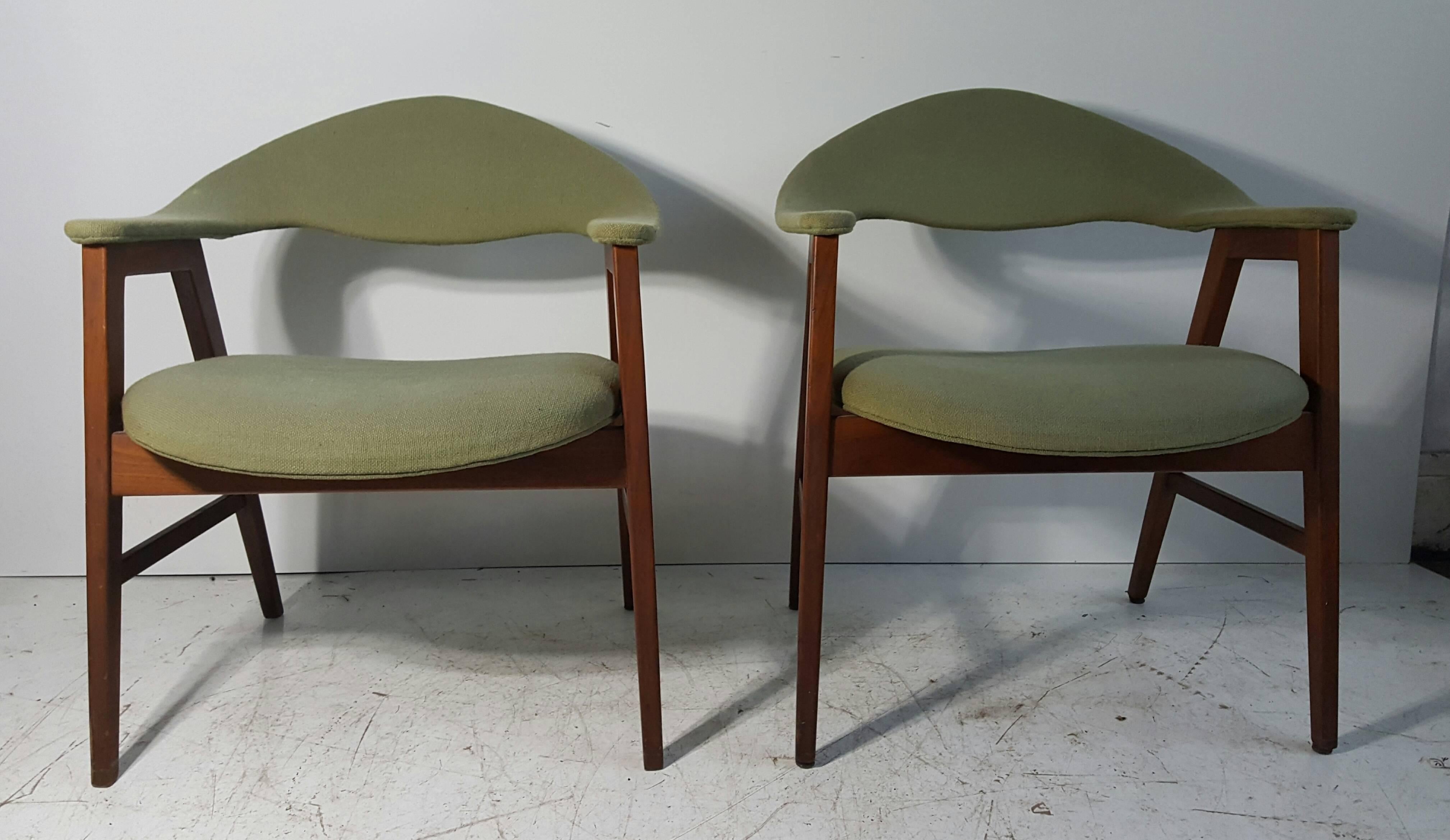 Classic pair Danish modern armchairs, teakwood frames and upholstery. Stunning lines, design... retains original green wool fabric, usable but would be fabulous reupholstered. Extremely comfortable.