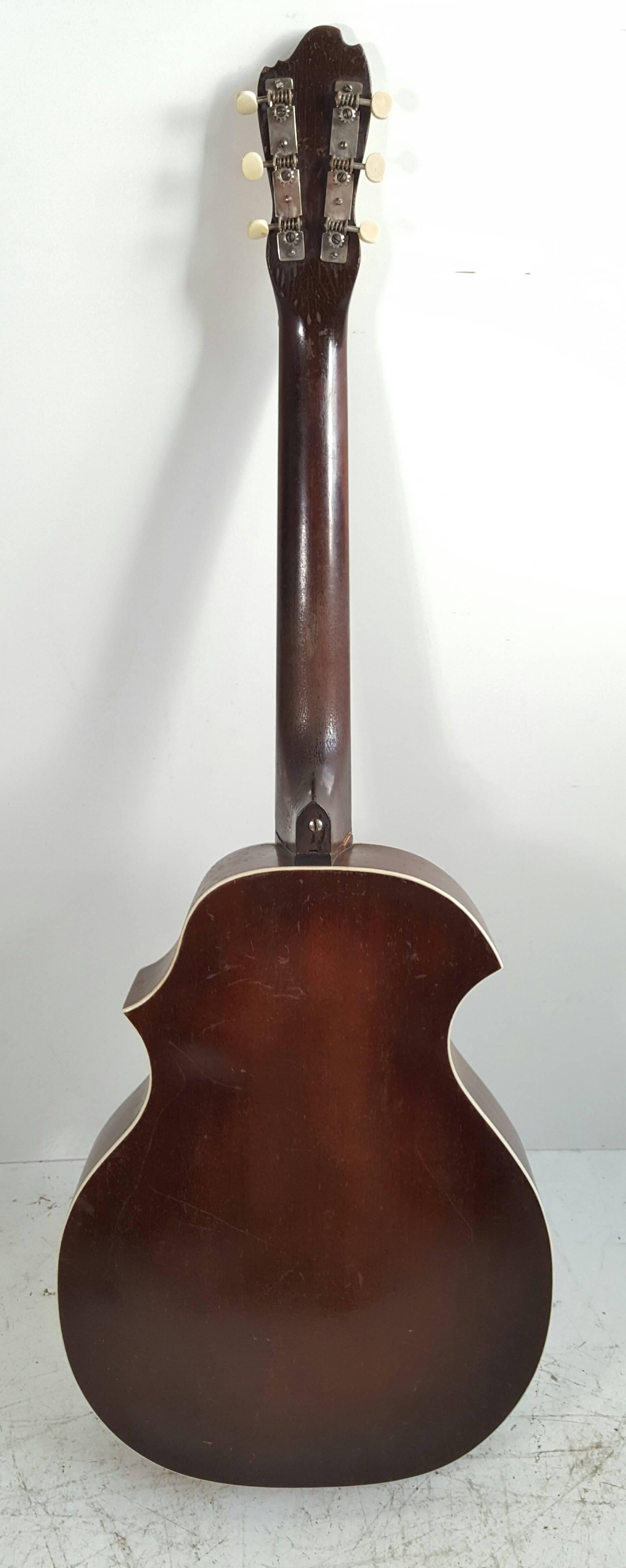 Seldom seen, early Kay Kraft acoustic guitar, wonderful styling, great playing instrument, nice original condition, minor crack to top, does not affect sound, missing pick guard.

The Kay Guitar Company was a division of the Kay Musical Instrument