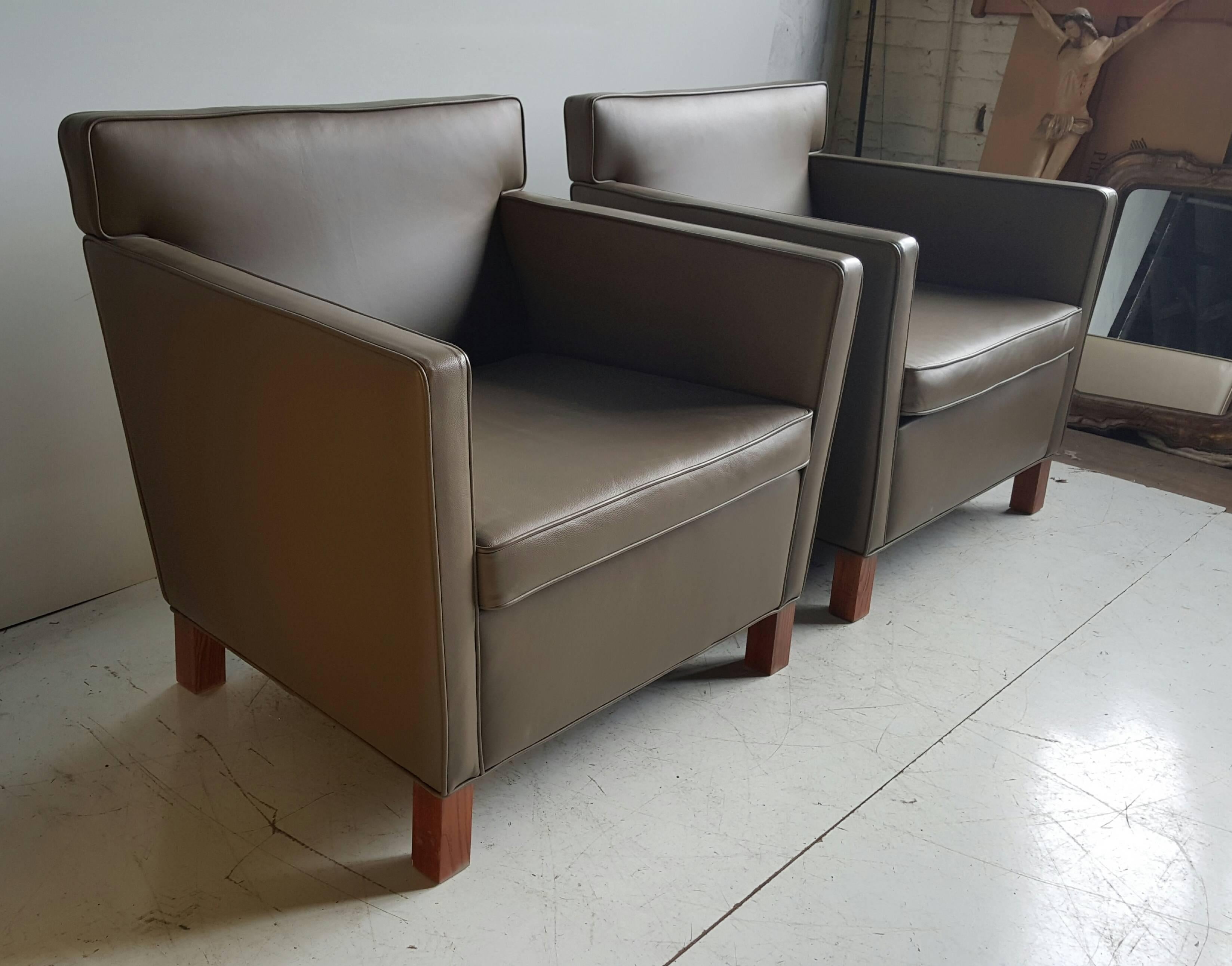 Pair of Mies van der Rohe Krefeld lounge or club chairs for Knoll with original spinneybeck leather upholstery. Recent production based on his 1927 design for the Esters and Lange residences in Krefeld, Germany. Measures: Arm: H 25 and seat is 18