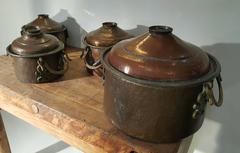 Set of Four Arts and Crafts Hand-Hammered Copper Pots