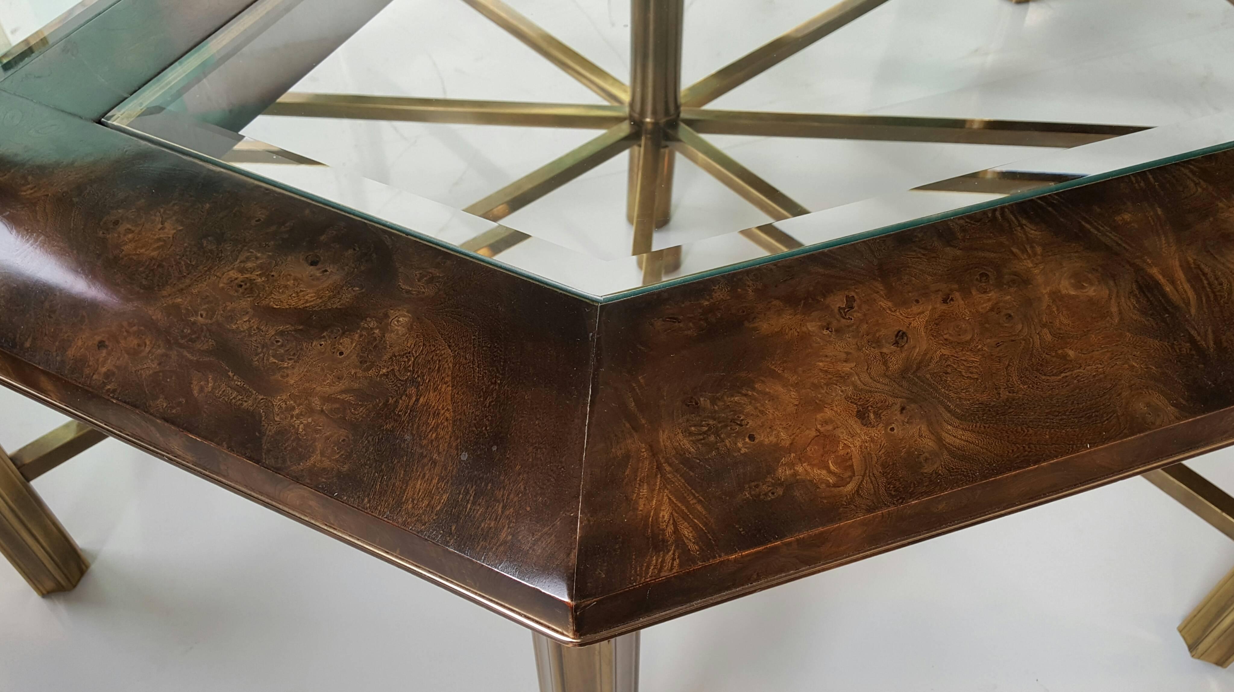 Rare eight-sided dining table manufactured by Mastercraft, finest of quality, constructed of burl elm, fabulous figuring, polished brass base and inlay, bevel glass inserts. Very limited production. One of five ever produced.
