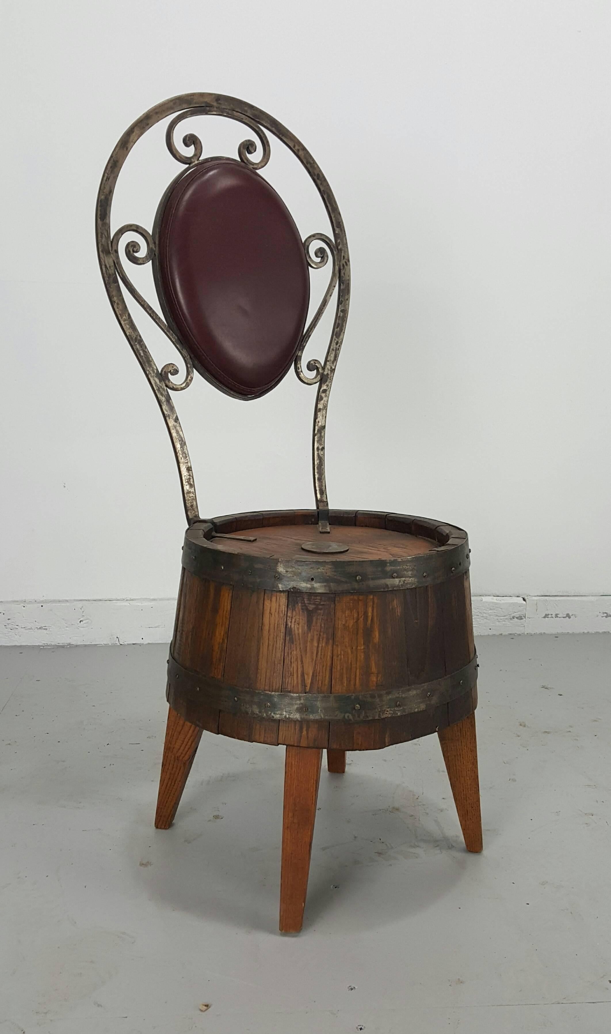 Unusual set of six whiskey barrel and hammered iron pub chairs. All handmade, cut barrels, legs attached, custom hand-forged decorative backs, perfect for card table, wine tasting chairs.