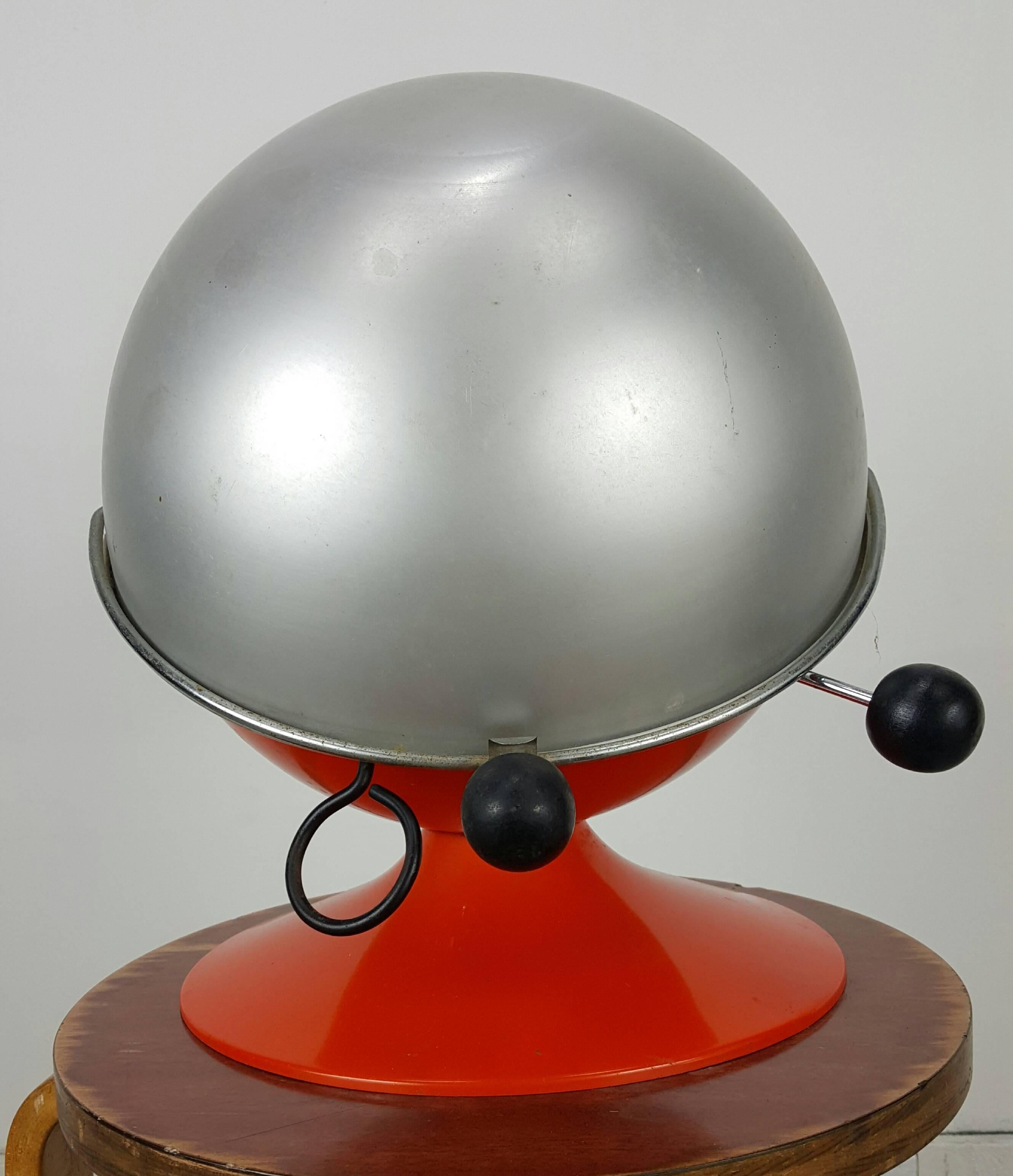This is the rare tabletop version of the bright orange Ball-B-Q BBQ made by Shepherd. Wonderful original condition. Retains original orange enamel paint and aluminum ball top. Adjustable height grilling racks. Spage Age sculpture.
