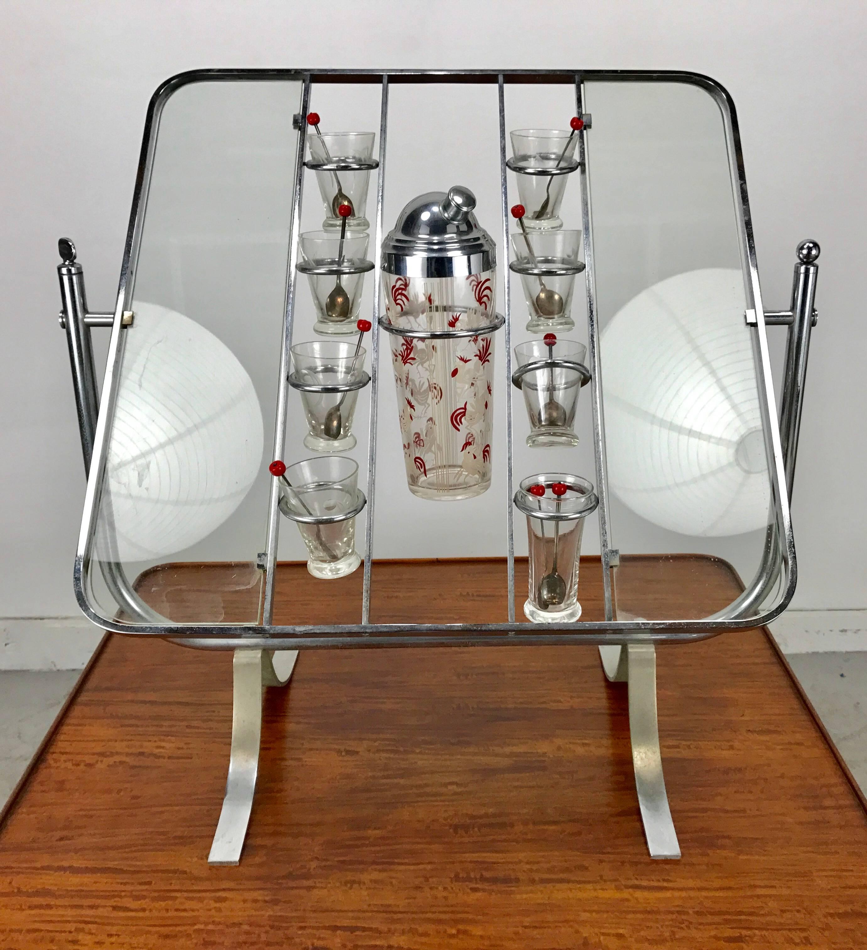 Rare Art Deco Gryo-scopic cocktail bar /serving tray table. This unique allows nickeled stand to be very sculptural when not in use, Ingenous pivoting and locking mechenism for various positions, designs. becoming useable serving table. Retains