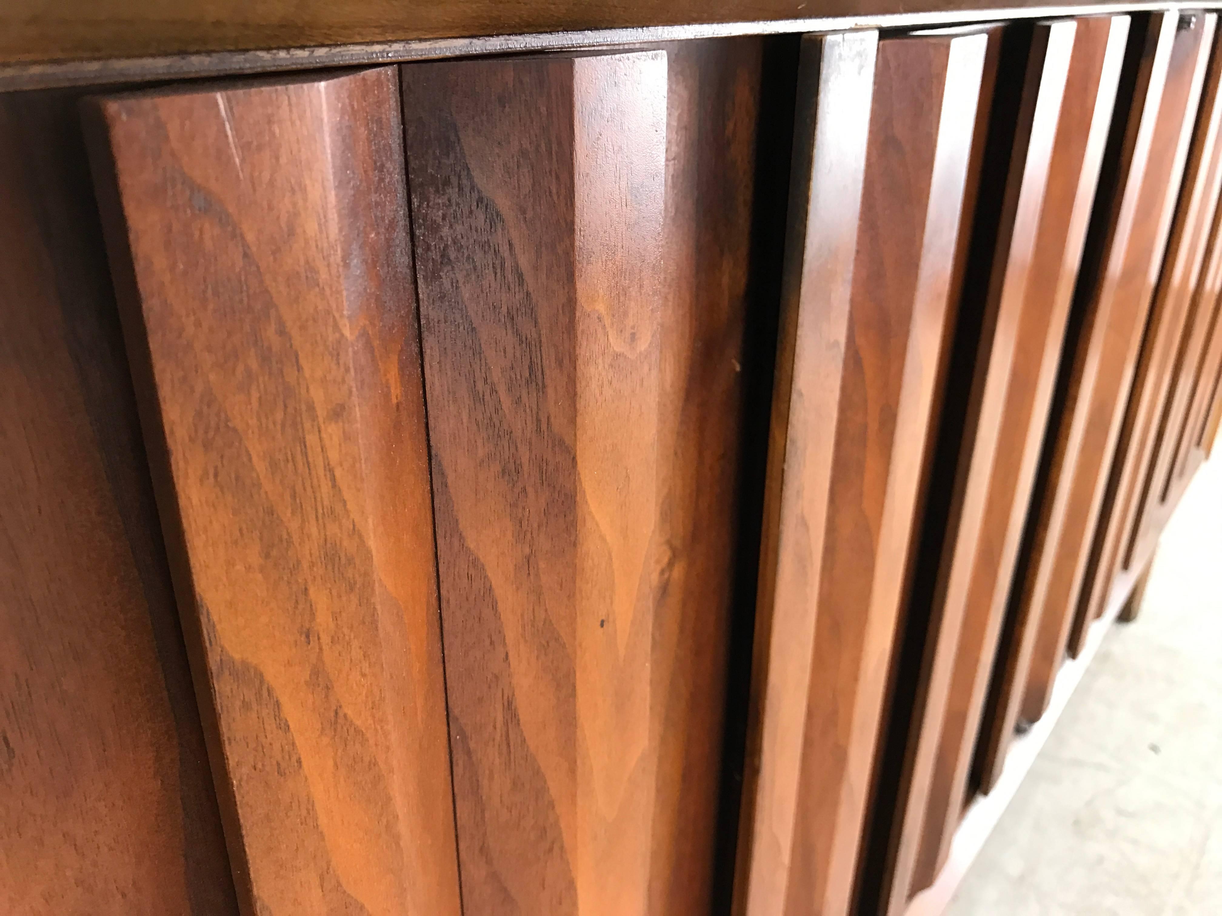 Modernist walnut cabinet/server, Brutalist design louver doors made by Lane, wonderful bookmatched figured walnut. Original finish/patina in excellent condition. Classic Mid-Century, superior quality,.