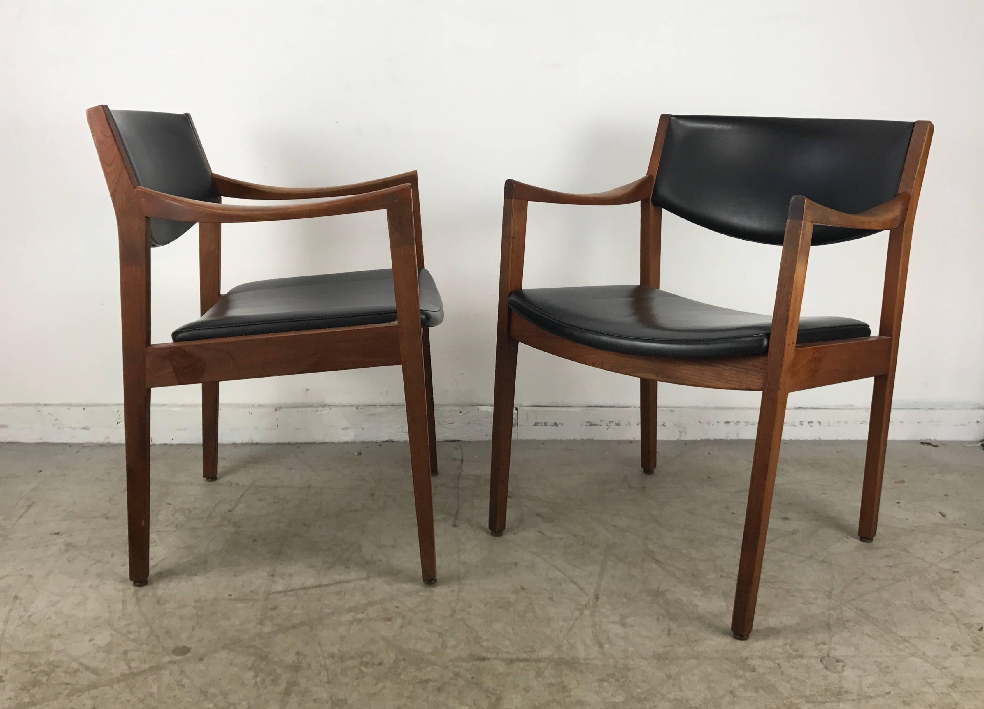 Stunning pair of modernist oiled walnut and Naugahyde armchairs manufactured by Gunlocke, extremely comfortable, solid, sturdy in the Manner of Jens Risom.