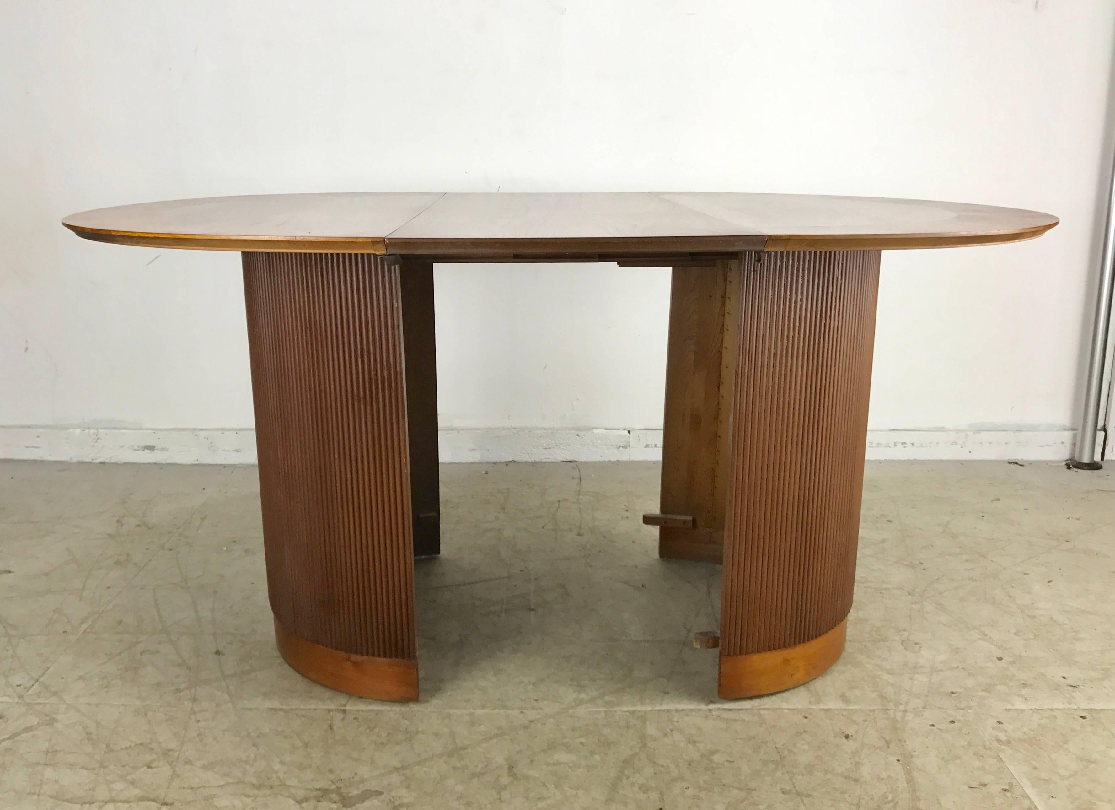 round dining table with cylinder base
