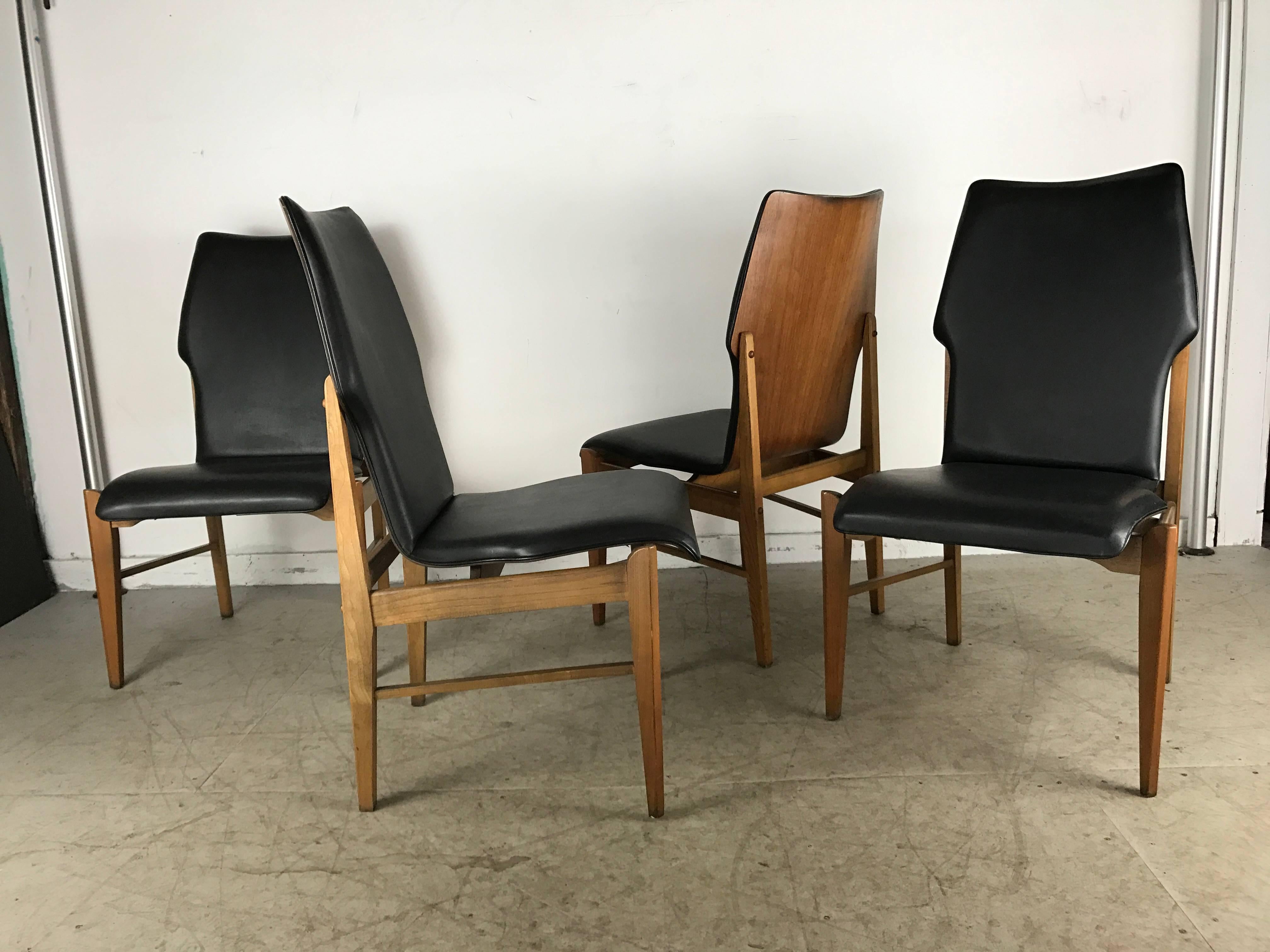 Set of four Mid-Century Modern high back dining chairs in walnut by Lane, Classic Mid-Century styling, walnut bent plywood tops Original black Naugahyde upholstery in beautiful condition, superior quality and construction, Extremely comfortable,