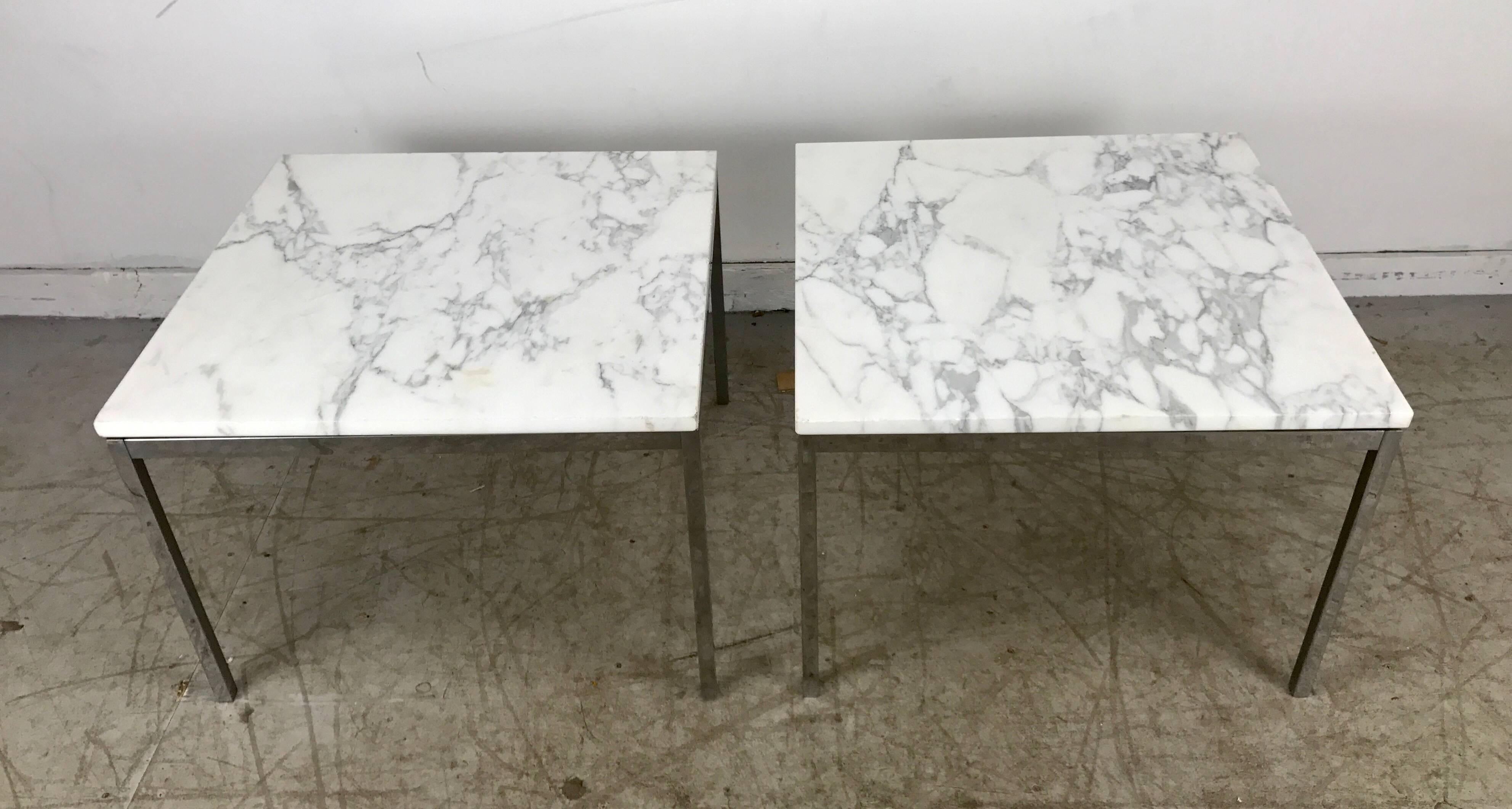 Classic pair of florence knoll marble and stainless end tables/knoll. Original white Carrara marble with black veining. Retains original Knoll New York label. Minor chips to edge and some staining. Age appropriate wear.