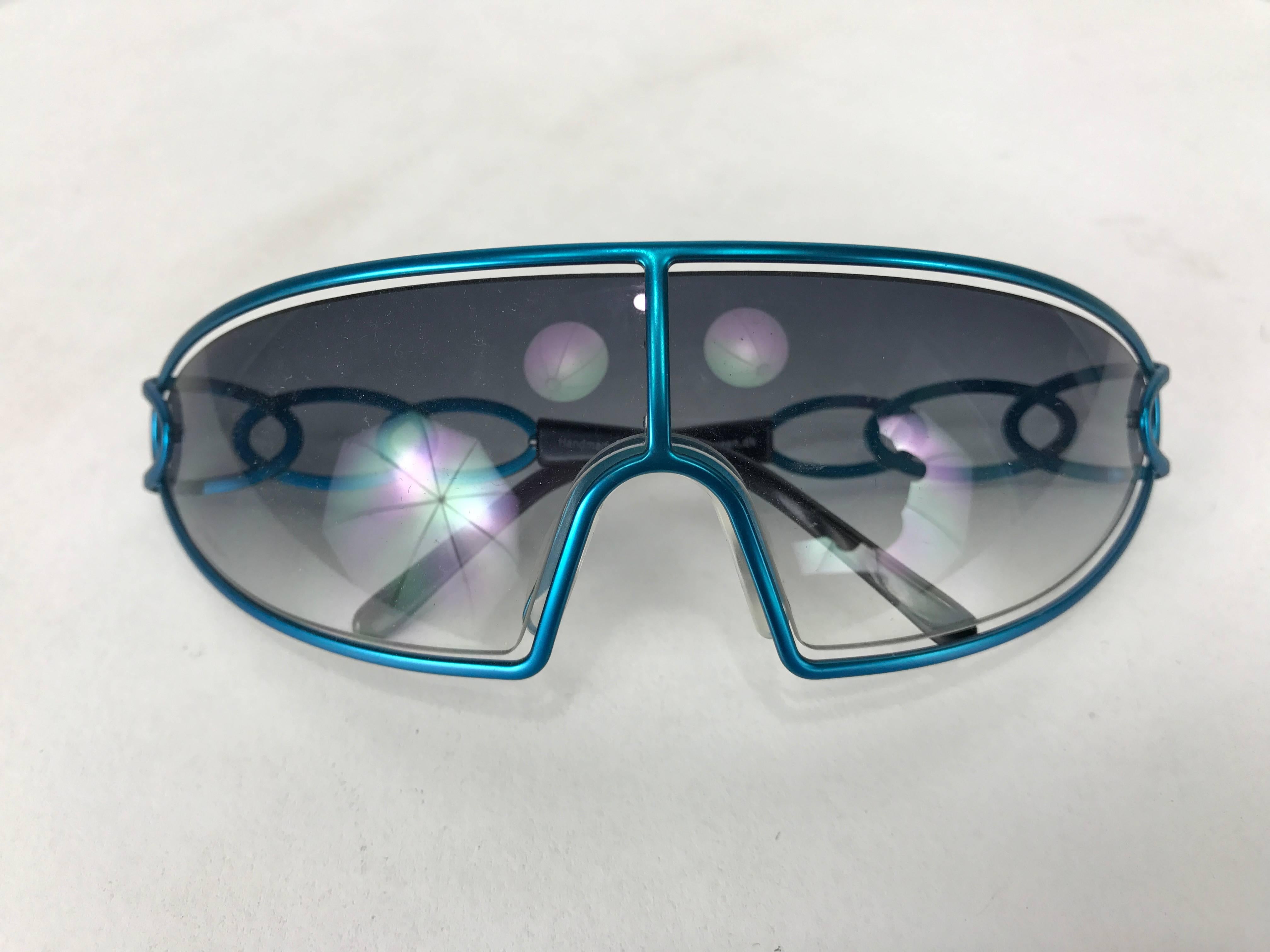 lconic Orgreen titanium frame sunglasses. Vintage new old stock eyewear, handmade in Italy, early 1990s vintage featuring blue anodized titanium frame, C-R 39 lens , a rare offering of the first design from this world renowned company, modeled after