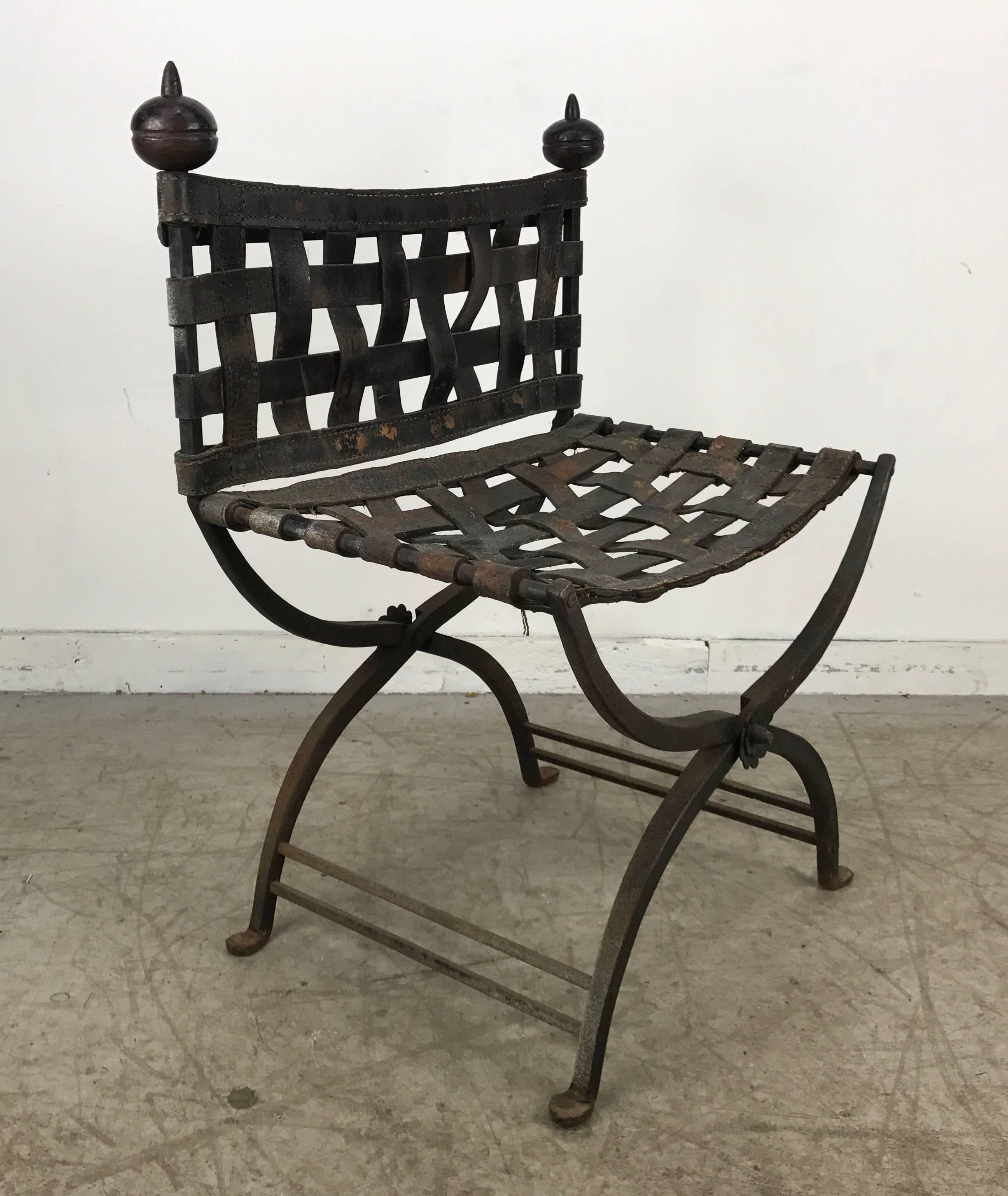 1920s Italian iron and leather Campaign chair. Retains original leather with age appropriate wear, see photo, iron frame and finials.