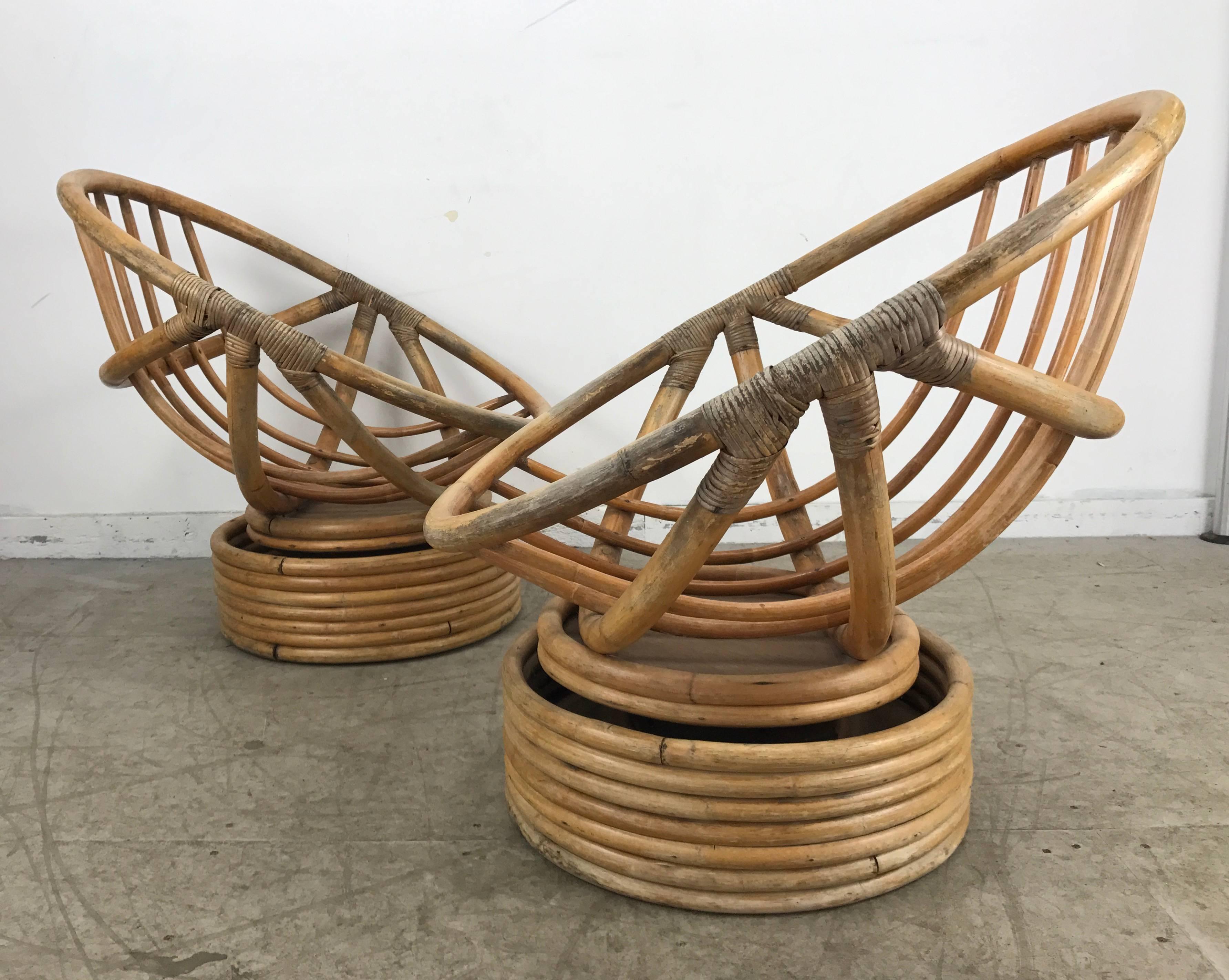 Classic pair of Mid-Century Modern Bamboo tilt/swivel platform hoop chairs by Calif-asia. Retain original seat and back cushion, extremely comfortable, Superior quality and sturdy construction.