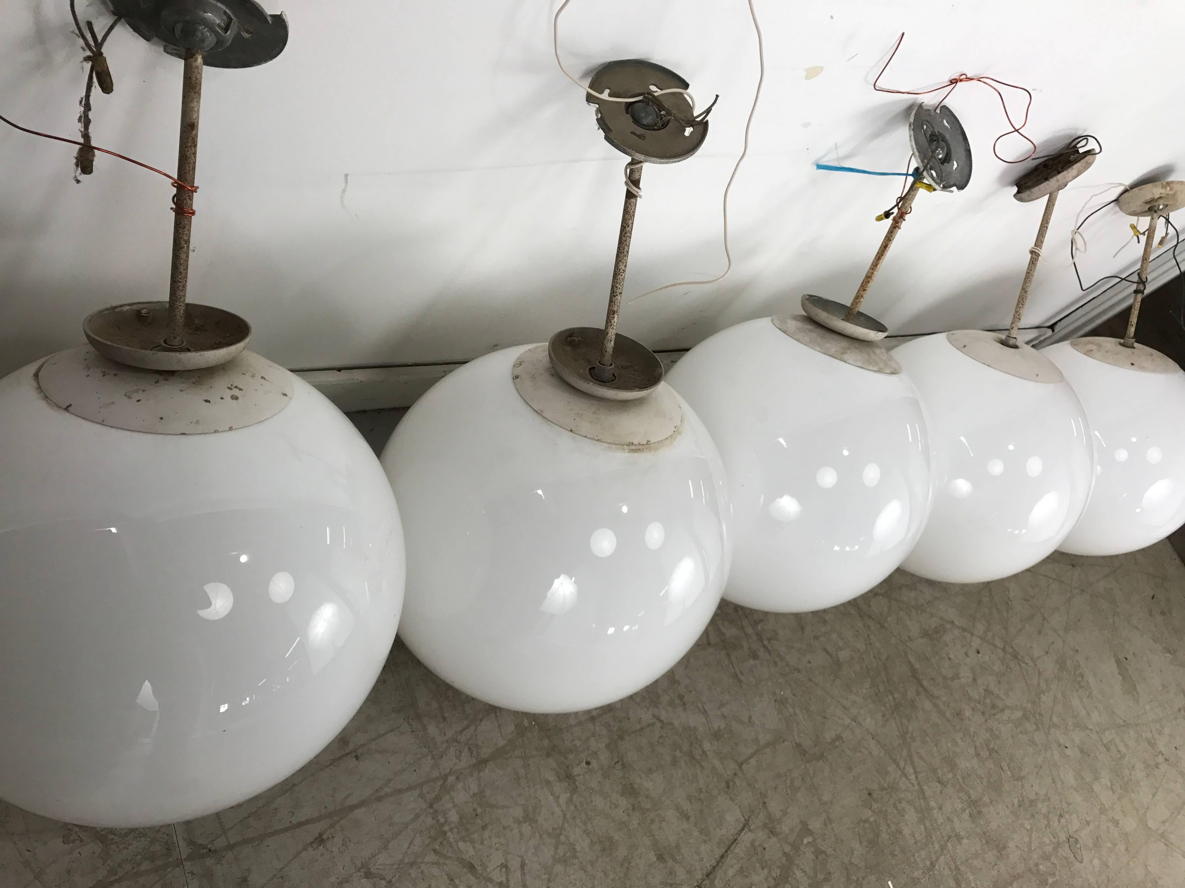 20th Century Five Matching Over-Sized White Glass Globe Pendant Lamps, Lightolier