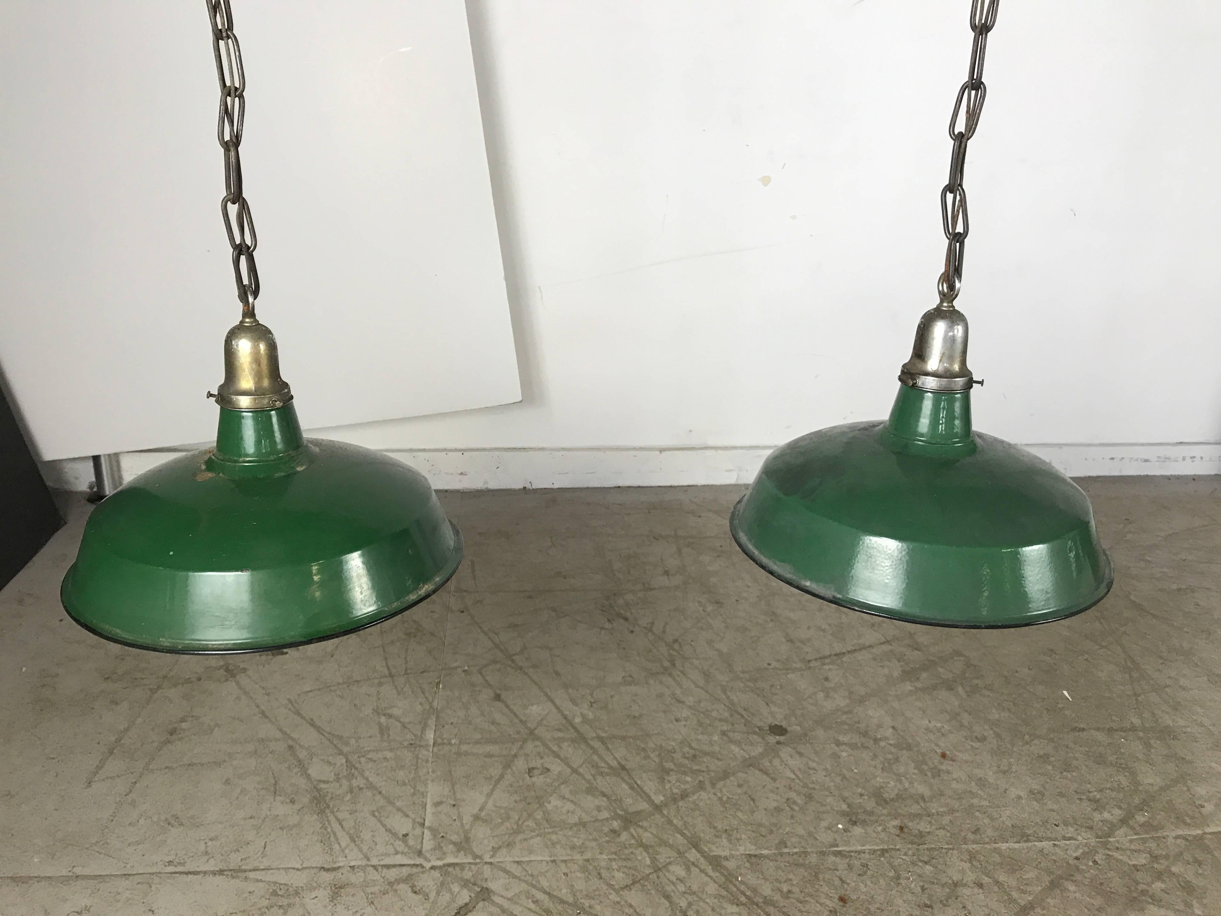 Unusual 1920s four-pendant bronze and nickel light fixture, from a turn of the century billiard hall in Jamestown, New York.

Featuring bronze standard with stunning machined nickel Art Deco details. Centre drop finial as well as stylized nickel