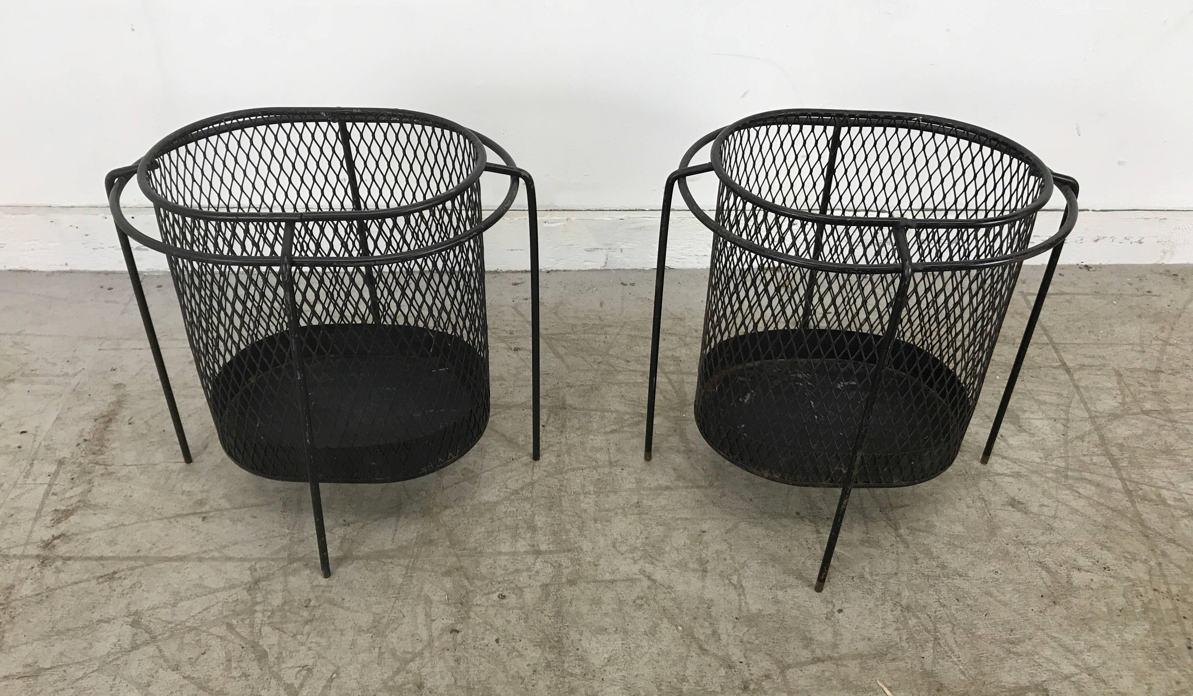 Matched pair of stylized Mid-Century Modern waste baskets /catch-all, wonderful design, spider like wire iron and iron mesh.