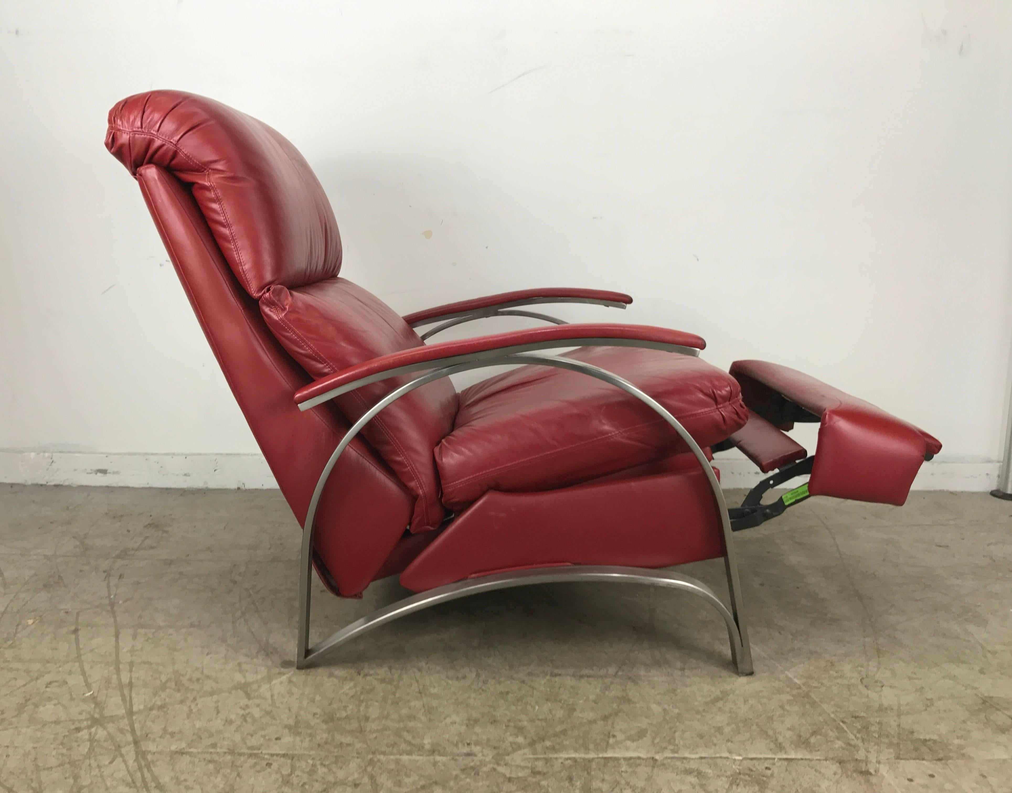 Contemporary red leather and chrome three position reclining lounge chair manufactured by Barcalounger, superior quality and construction, Extremely comfortable, hand delivery available to New York City or anywhere en route from Buffalo ny.
