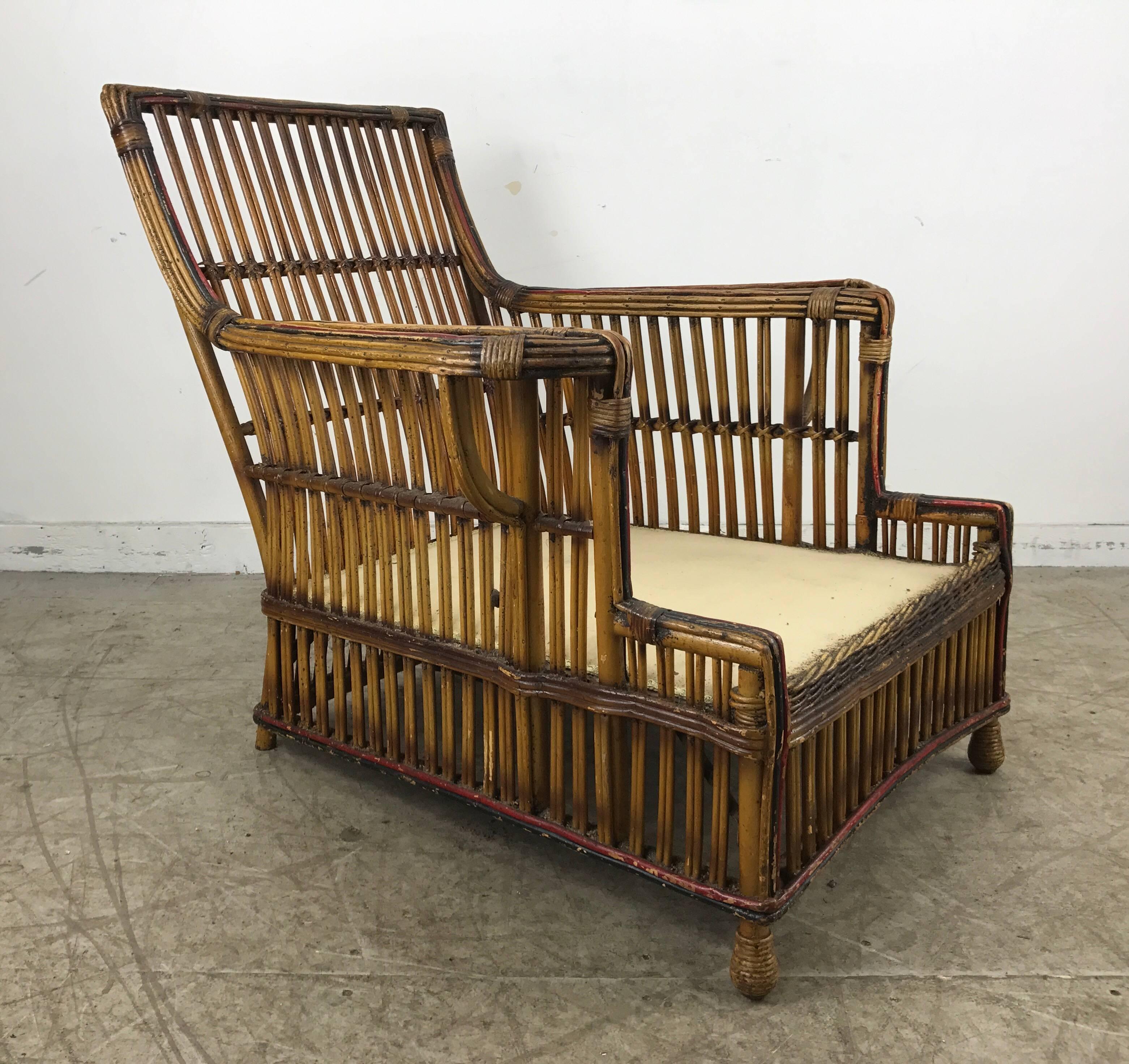 Stunning art deco split reed / stick wicker lounge chair by Niagara Reedcraft Inc. Niagara falls NY, retains original natural finish accented by red and black detailing, superior quality and construction, also available matching three-seat sofa,