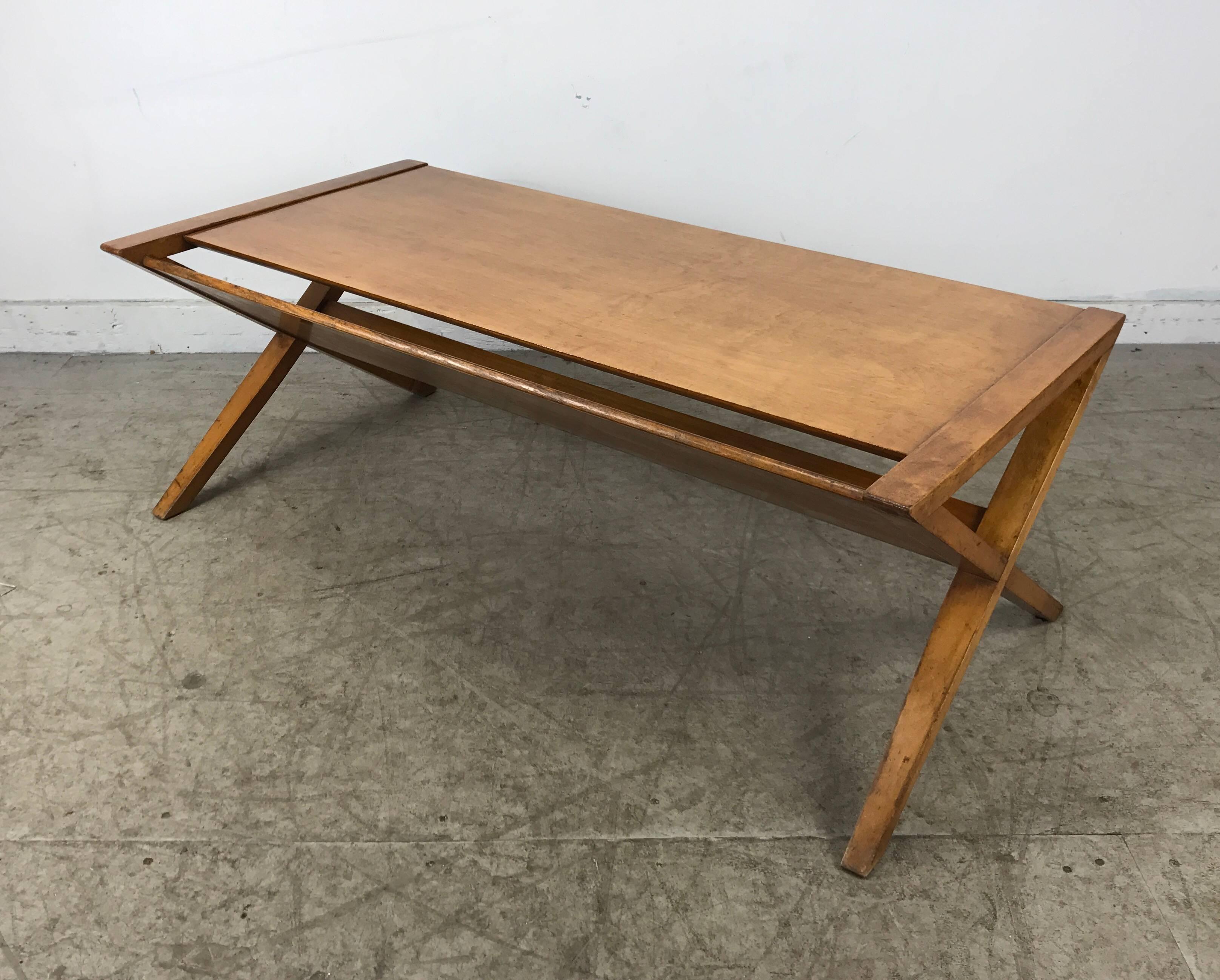 Modernist blonde mahogany coffee / magazine table. X-sides. Manner of Robsjohn Gibbings, Classic Modernist design.