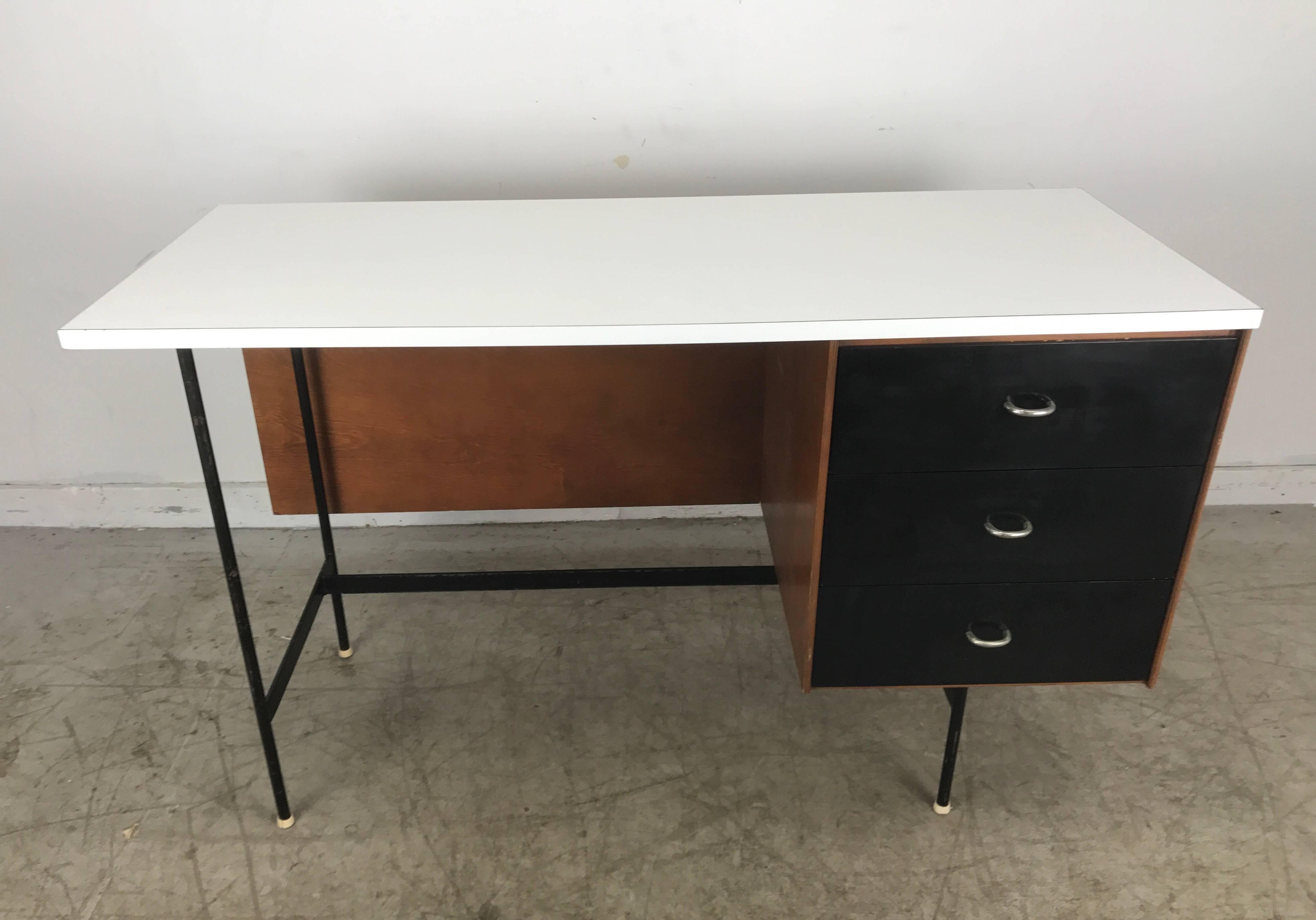 Classic Mid-Century Modern Desk by Thonet manner of Finn Juhl, striking design, architectural iron frame, birch ply body with black laminate drawer fronts, molded plastic interiors, aluminum pulls and white laminate top. Hand delivery avail to New