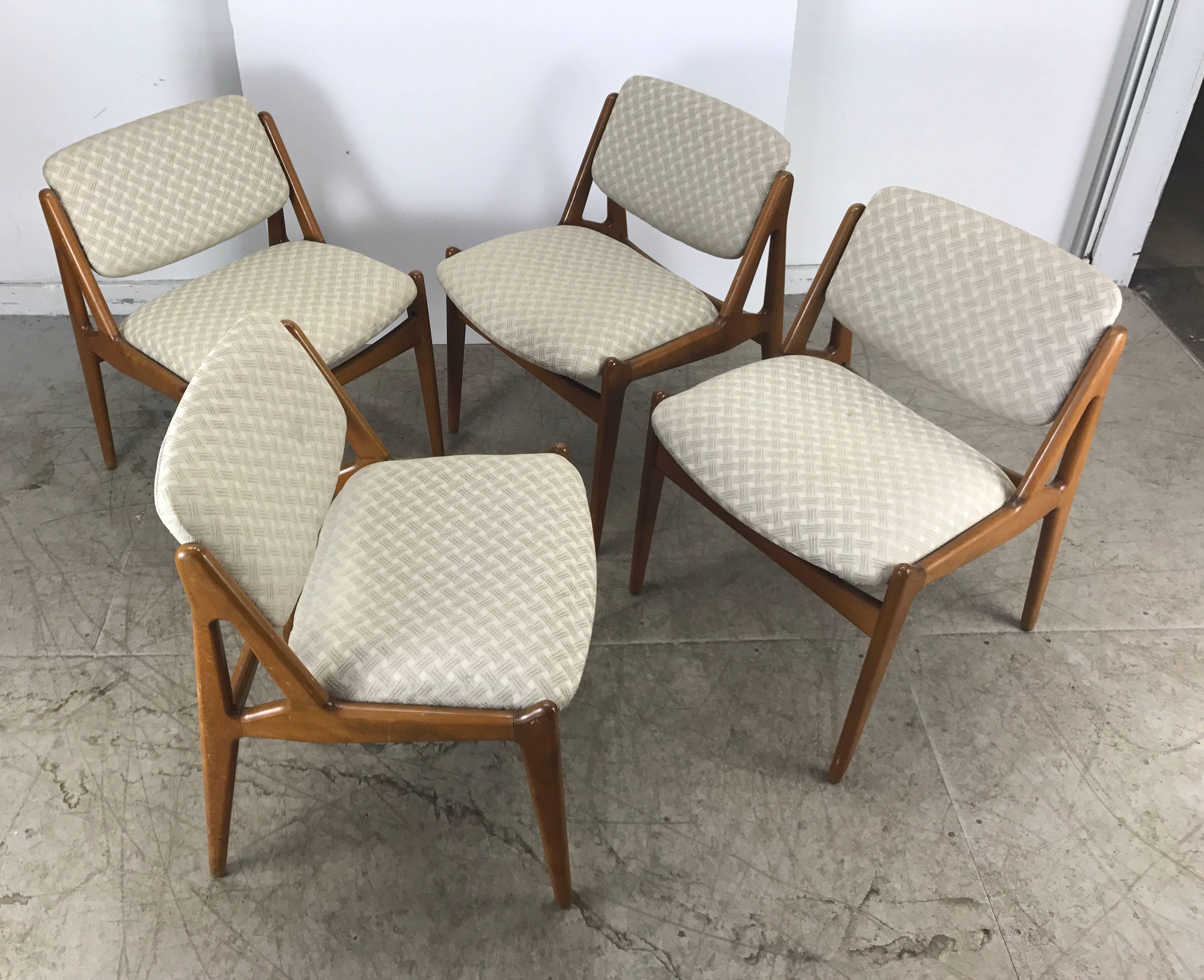 A set of four Danish Mid-Century Modern teak dining chairs by Arne Vodder for Vamo Sonderborg, solid sculptural teak frames with swivel backs for extra comfort, Hand delivery avail to New York City or anywhere enroute from Buffalo New York.