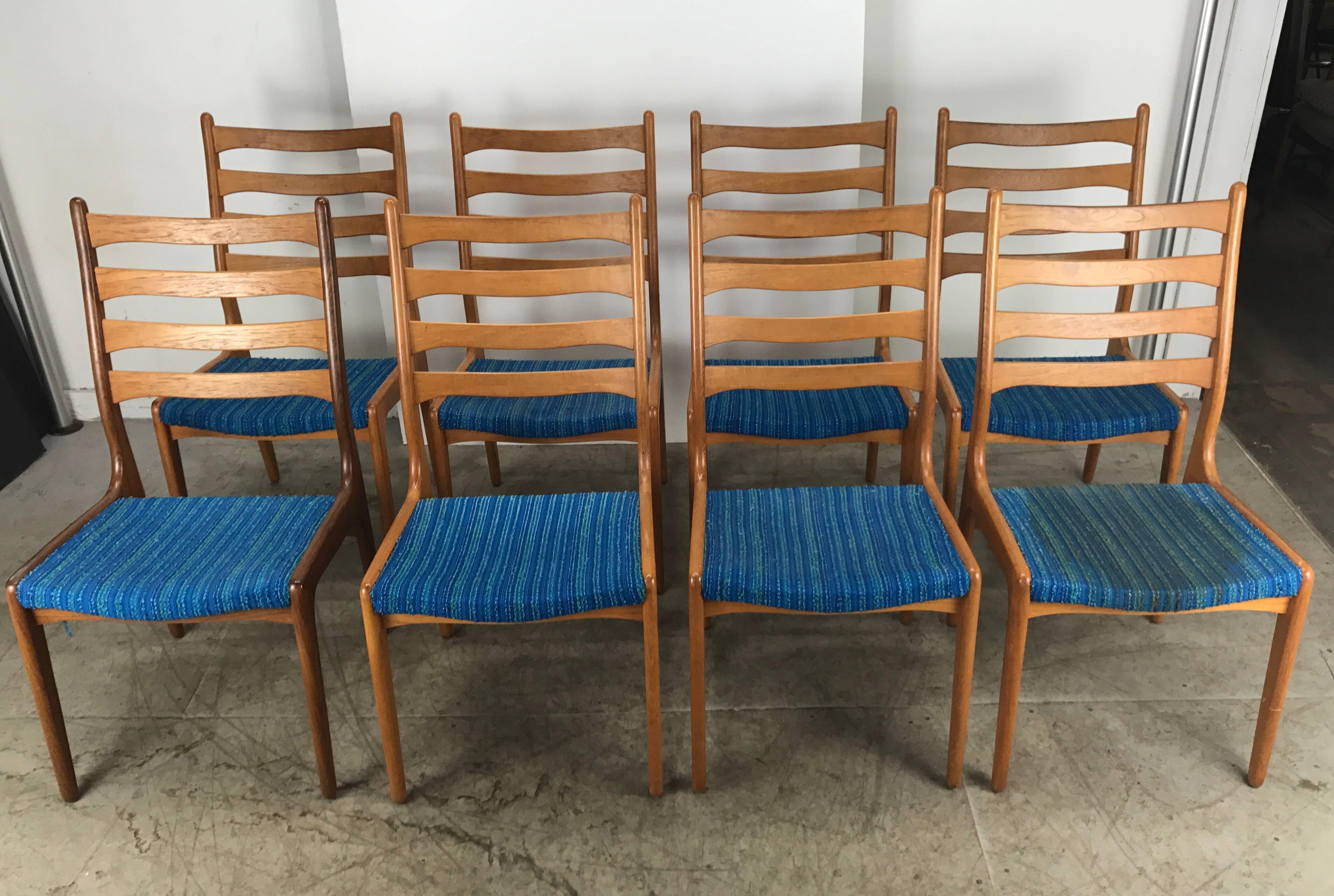 Set of eight Poul Volther teak side chairs by Frem Rojle, Classic Mid-Century design, superior quality and construction, finger joinery. Retains original Alexander Girard electric blue wool fabric, stunning, hand delivery available to New York City
