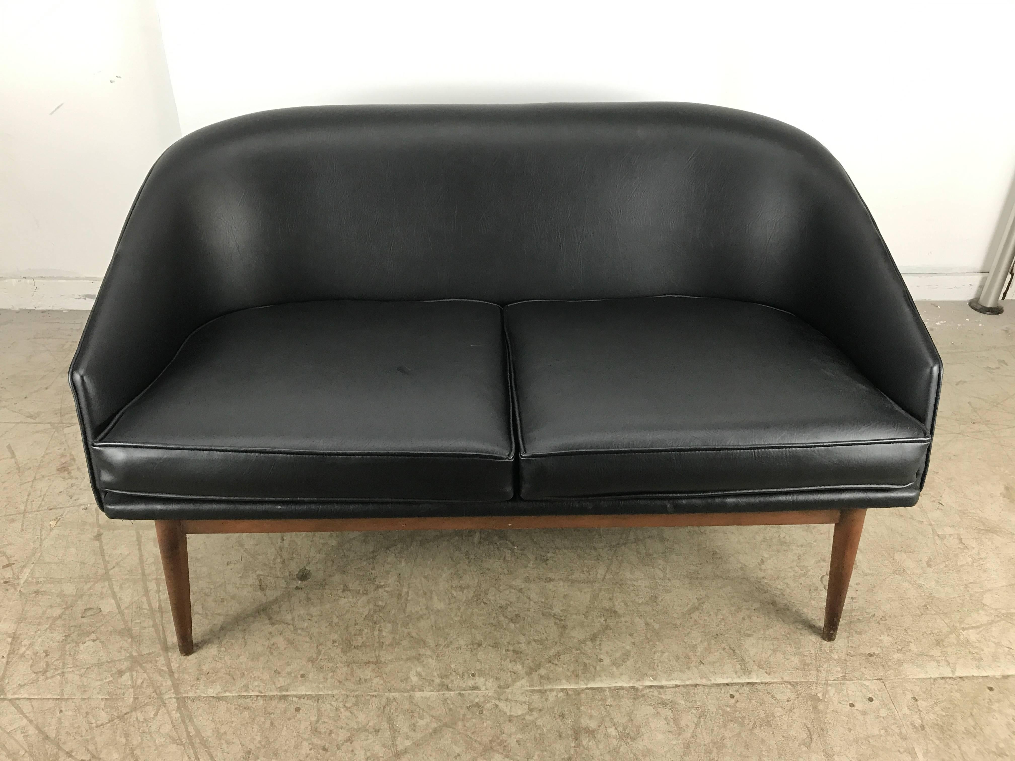 Classic Danish Modern two-seat sofa attributed to Arne Hovmand Olsen, Denmark, Recently reupholstered in a black Naugahyde, quality, sturdy teak base, extremely comfortable and stylish, hand delivery avail to New York City of anywhere enroute from