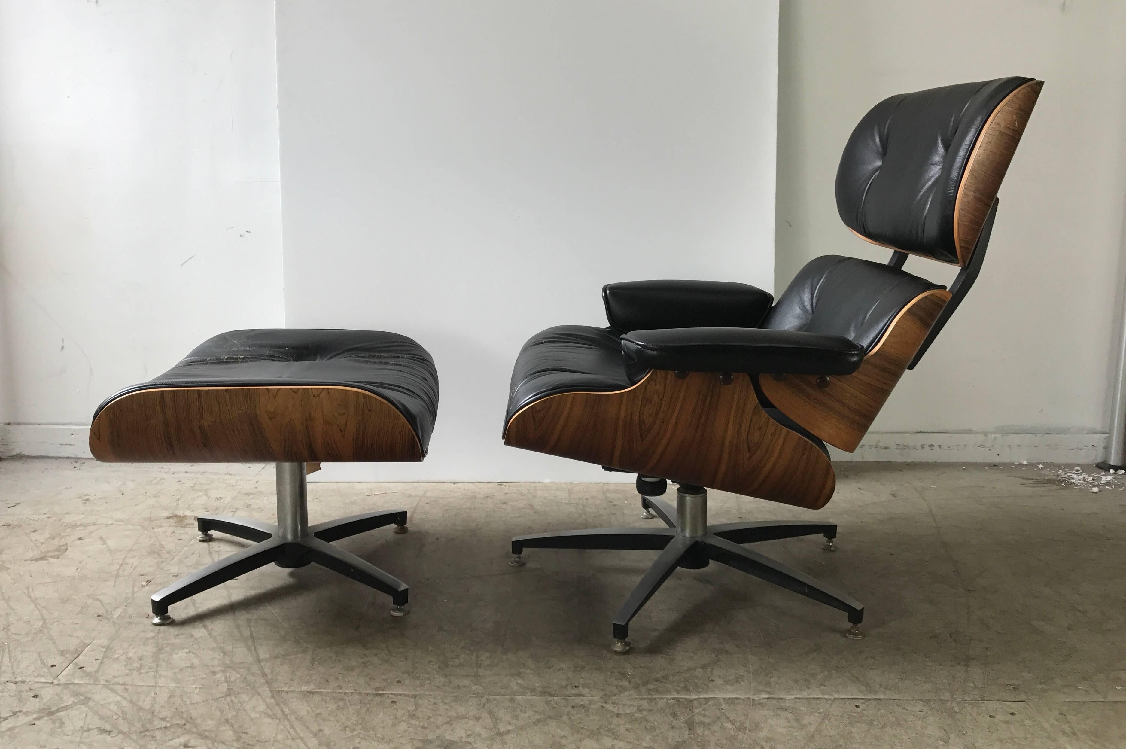 Modernist rosewood and leather Eames style 670 lounge chair and ottoman. Charlton Company's version said to be the closest reproduction to the Classic Herman Miller, Began production shortly after the original manufactured in 1956,Beautuful original